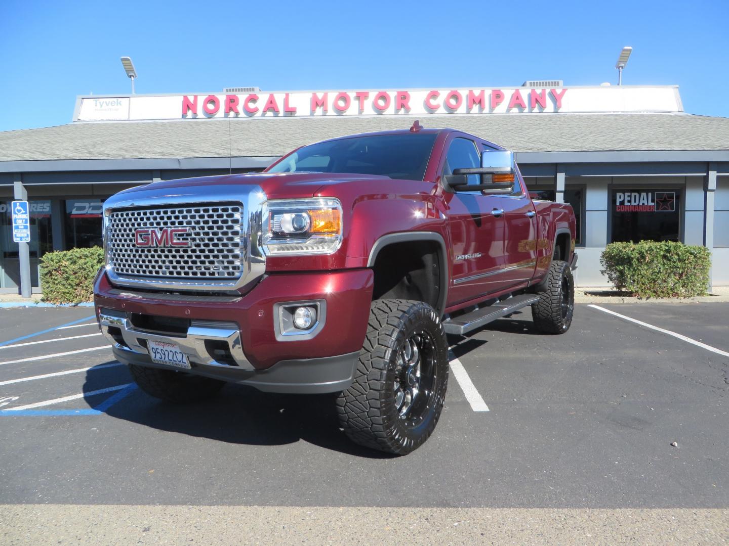 2016 Crimson Red /BLACK GMC Sierra 2500 HD Crew Cab (1GT12UE81GF) with an V8 Turbo Dsl 6.6L engine, Auto 6-Spd Allison OD transmission, located at 2630 Grass Valley Highway, Auburn, CA, 95603, (530) 508-5100, 38.937893, -121.095482 - BDS suspension, Fox Shocks, SOTA Novkane wheels, Nitto Ridge Grappler tires, AMP bed extender, and Husky Floor liners. - Photo#0