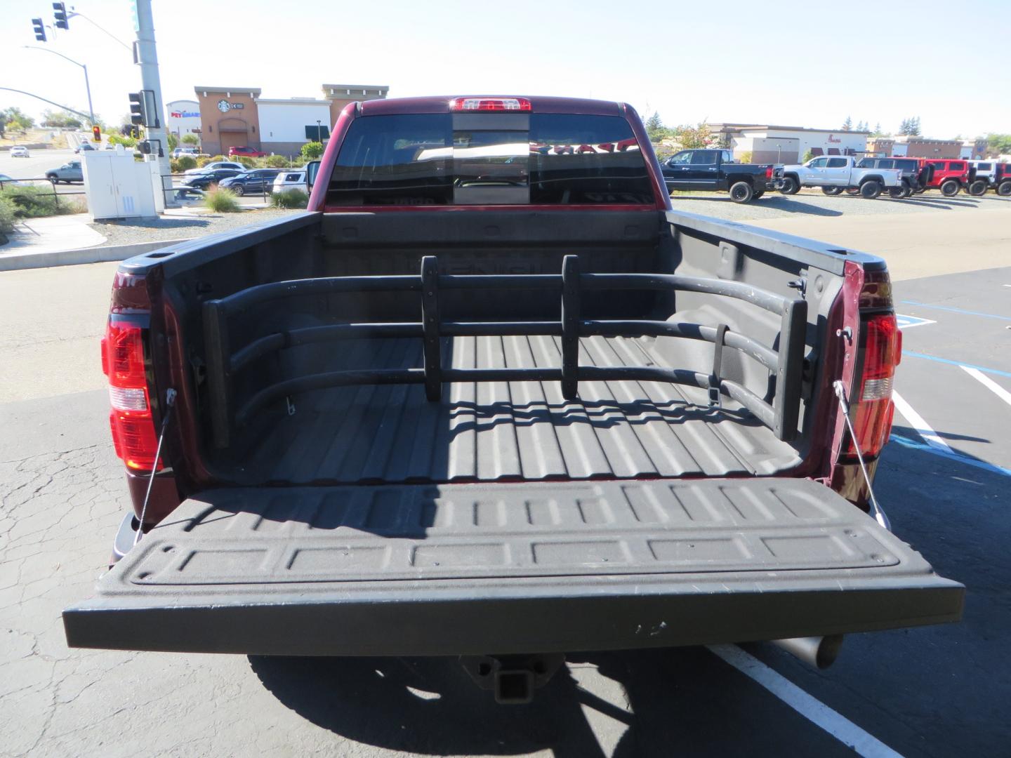 2016 Crimson Red /BLACK GMC Sierra 2500 HD Crew Cab (1GT12UE81GF) with an V8 Turbo Dsl 6.6L engine, Auto 6-Spd Allison OD transmission, located at 2630 Grass Valley Highway, Auburn, CA, 95603, (530) 508-5100, 38.937893, -121.095482 - BDS suspension, Fox Shocks, SOTA Novkane wheels, Nitto Ridge Grappler tires, AMP bed extender, and Husky Floor liners. - Photo#10