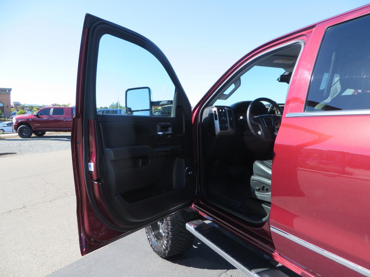 2016 Crimson Red /BLACK GMC Sierra 2500 HD Crew Cab (1GT12UE81GF) with an V8 Turbo Dsl 6.6L engine, Auto 6-Spd Allison OD transmission, located at 2630 Grass Valley Highway, Auburn, CA, 95603, (530) 508-5100, 38.937893, -121.095482 - BDS suspension, Fox Shocks, SOTA Novkane wheels, Nitto Ridge Grappler tires, AMP bed extender, and Husky Floor liners. - Photo#12