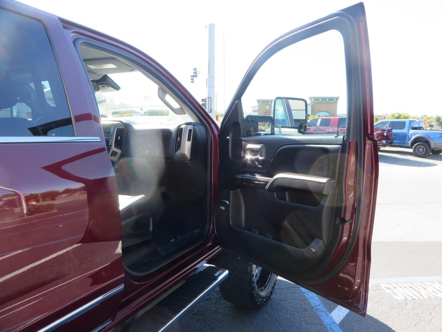 2016 Crimson Red /BLACK GMC Sierra 2500 HD Crew Cab (1GT12UE81GF) with an V8 Turbo Dsl 6.6L engine, Auto 6-Spd Allison OD transmission, located at 2630 Grass Valley Highway, Auburn, CA, 95603, (530) 508-5100, 38.937893, -121.095482 - BDS suspension, Fox Shocks, SOTA Novkane wheels, Nitto Ridge Grappler tires, AMP bed extender, and Husky Floor liners. - Photo#36