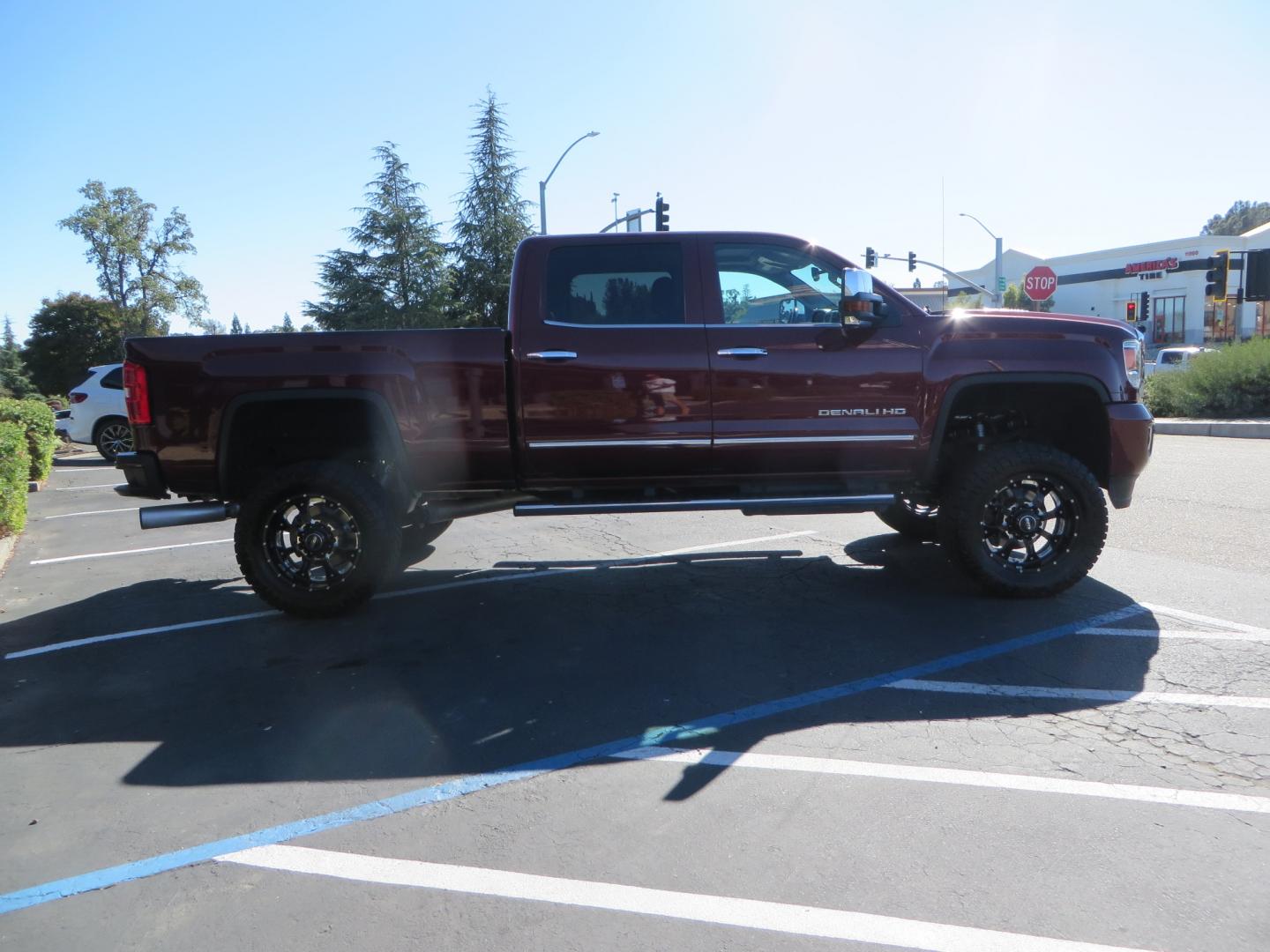 2016 Crimson Red /BLACK GMC Sierra 2500 HD Crew Cab (1GT12UE81GF) with an V8 Turbo Dsl 6.6L engine, Auto 6-Spd Allison OD transmission, located at 2630 Grass Valley Highway, Auburn, CA, 95603, (530) 508-5100, 38.937893, -121.095482 - BDS suspension, Fox Shocks, SOTA Novkane wheels, Nitto Ridge Grappler tires, AMP bed extender, and Husky Floor liners. - Photo#3