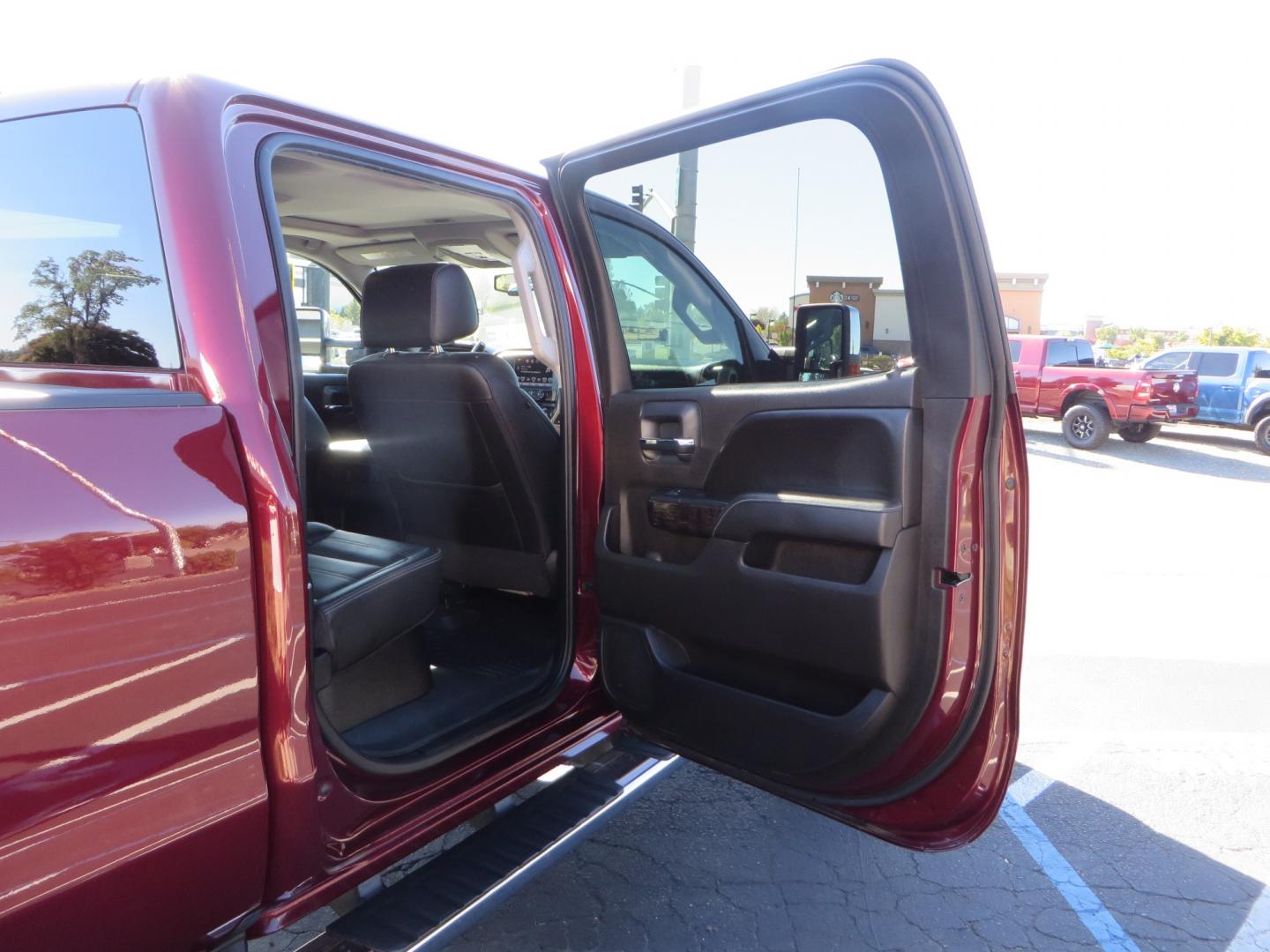 2016 Crimson Red /BLACK GMC Sierra 2500 HD Crew Cab (1GT12UE81GF) with an V8 Turbo Dsl 6.6L engine, Auto 6-Spd Allison OD transmission, located at 2630 Grass Valley Highway, Auburn, CA, 95603, (530) 508-5100, 38.937893, -121.095482 - BDS suspension, Fox Shocks, SOTA Novkane wheels, Nitto Ridge Grappler tires, AMP bed extender, and Husky Floor liners. - Photo#44