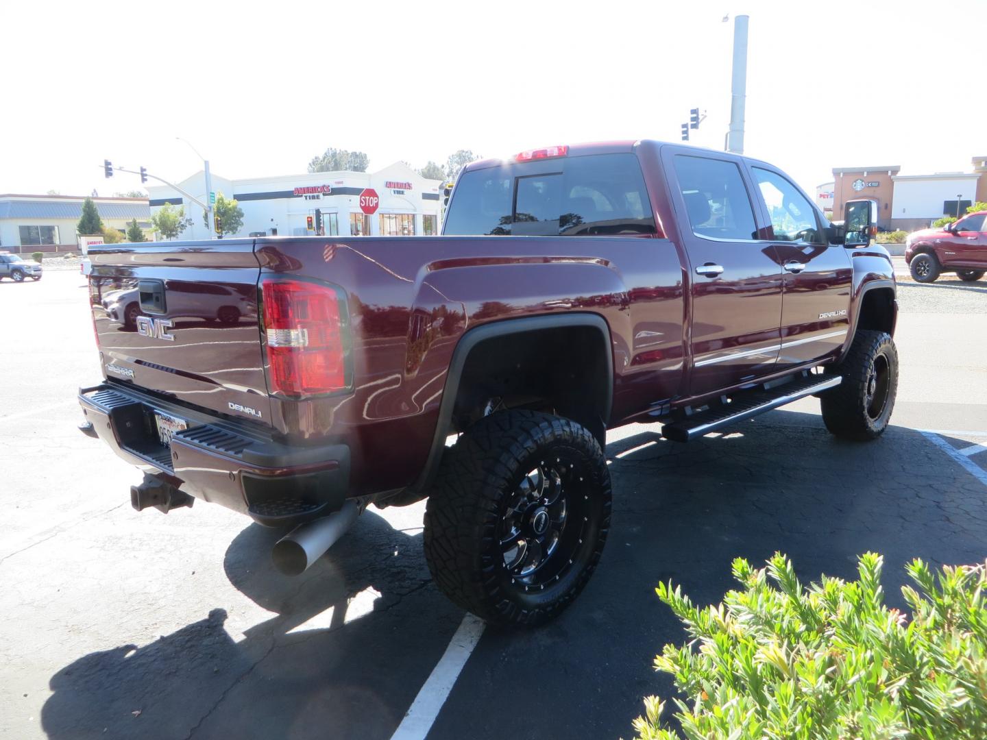 2016 Crimson Red /BLACK GMC Sierra 2500 HD Crew Cab (1GT12UE81GF) with an V8 Turbo Dsl 6.6L engine, Auto 6-Spd Allison OD transmission, located at 2630 Grass Valley Highway, Auburn, CA, 95603, (530) 508-5100, 38.937893, -121.095482 - BDS suspension, Fox Shocks, SOTA Novkane wheels, Nitto Ridge Grappler tires, AMP bed extender, and Husky Floor liners. - Photo#4