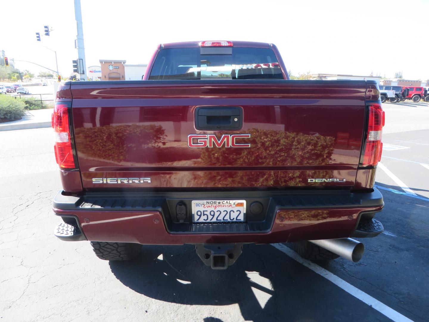 2016 Crimson Red /BLACK GMC Sierra 2500 HD Crew Cab (1GT12UE81GF) with an V8 Turbo Dsl 6.6L engine, Auto 6-Spd Allison OD transmission, located at 2630 Grass Valley Highway, Auburn, CA, 95603, (530) 508-5100, 38.937893, -121.095482 - BDS suspension, Fox Shocks, SOTA Novkane wheels, Nitto Ridge Grappler tires, AMP bed extender, and Husky Floor liners. - Photo#5