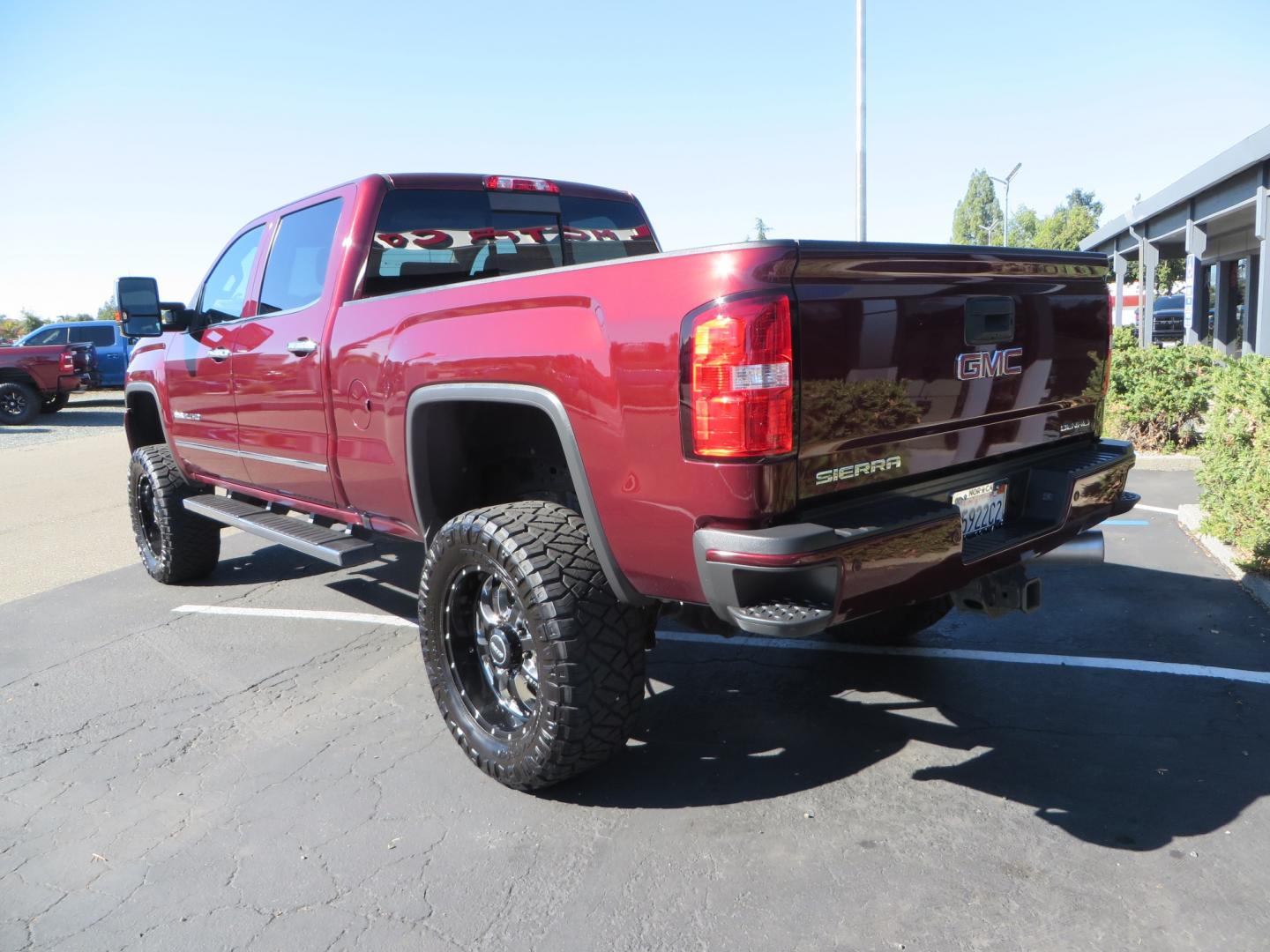 2016 Crimson Red /BLACK GMC Sierra 2500 HD Crew Cab (1GT12UE81GF) with an V8 Turbo Dsl 6.6L engine, Auto 6-Spd Allison OD transmission, located at 2630 Grass Valley Highway, Auburn, CA, 95603, (530) 508-5100, 38.937893, -121.095482 - BDS suspension, Fox Shocks, SOTA Novkane wheels, Nitto Ridge Grappler tires, AMP bed extender, and Husky Floor liners. - Photo#6