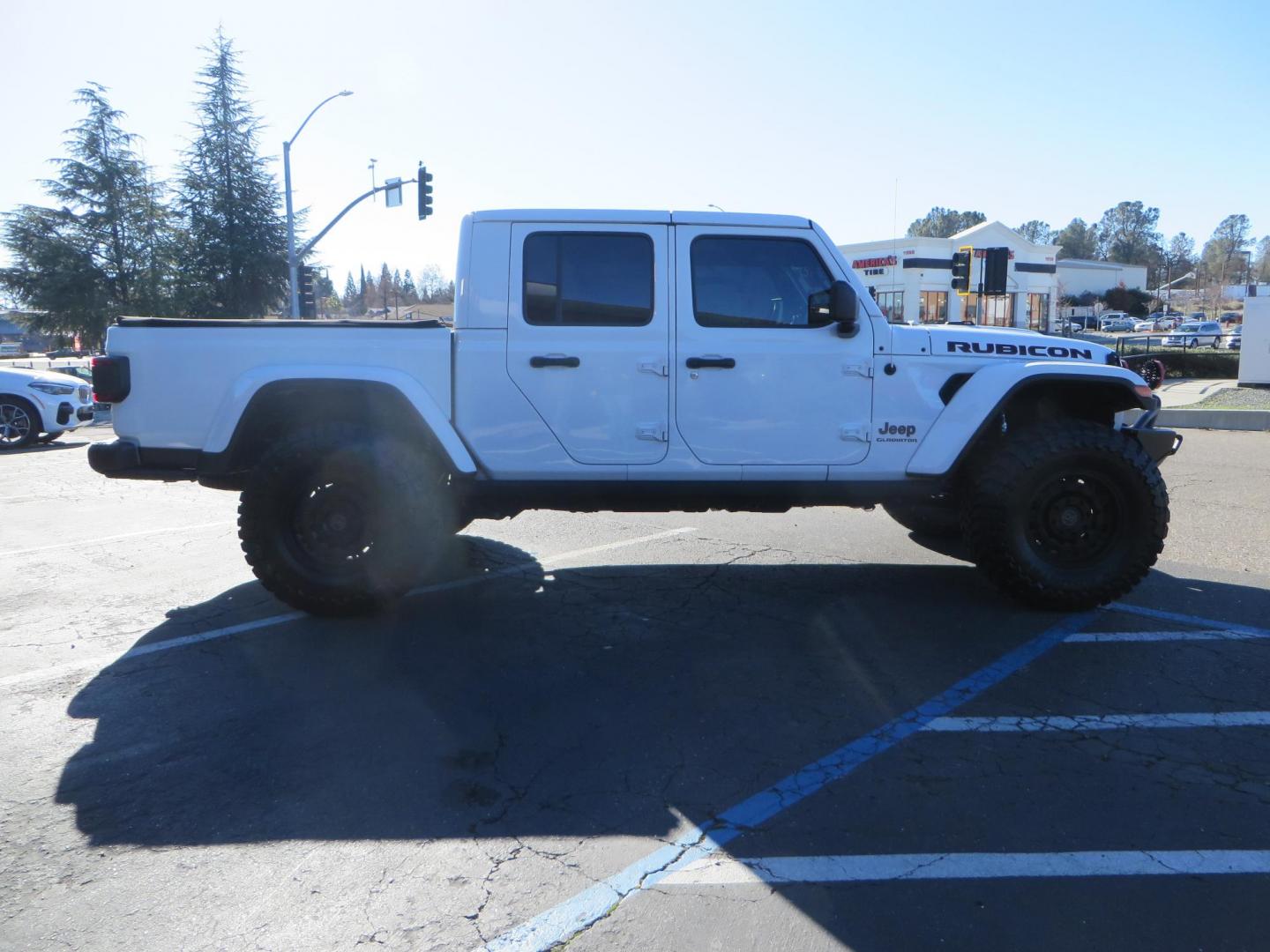 2020 White Jeep Gladiator Rubicon Launch Edition (1C6JJTBG5LL) with an V6 VVT 3.6 Liter engine, Automatic 8-Spd transmission, located at 2630 Grass Valley Highway, Auburn, CA, 95603, (530) 508-5100, 38.937893, -121.095482 - Gladiator Launch Edition, with JKS suspension, Fox shocks and steering stabilizer, 37" Toyo MT tires, Black Rhino Arsenal wheels, Warn Winch, LED lights and Tinted windows. - Photo#3