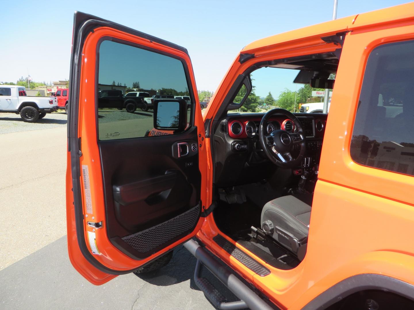 2020 ORANGE /black Jeep Wrangler Rubicon (1C4HJXCG3LW) with an 3.6L V6 DOHC 24V FFV engine, 6A transmission, located at 2630 Grass Valley Highway, Auburn, CA, 95603, (530) 508-5100, 38.937893, -121.095482 - Teraflex suspension, Fox Shocks, Mopar simulated beadlock wheels, 37" BFG KO2 tires, Running boards, Oracle tail lights, window tint, Weathertech floor liners, and a Redline subwoofer. - Photo#15