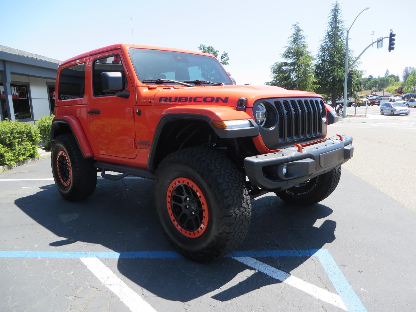 2020 ORANGE /black Jeep Wrangler Rubicon (1C4HJXCG3LW) with an 3.6L V6 DOHC 24V FFV engine, 6A transmission, located at 2630 Grass Valley Highway, Auburn, CA, 95603, (530) 508-5100, 38.937893, -121.095482 - Teraflex suspension, Fox Shocks, Mopar simulated beadlock wheels, 37" BFG KO2 tires, Running boards, Oracle tail lights, window tint, Weathertech floor liners, and a Redline subwoofer. - Photo#2