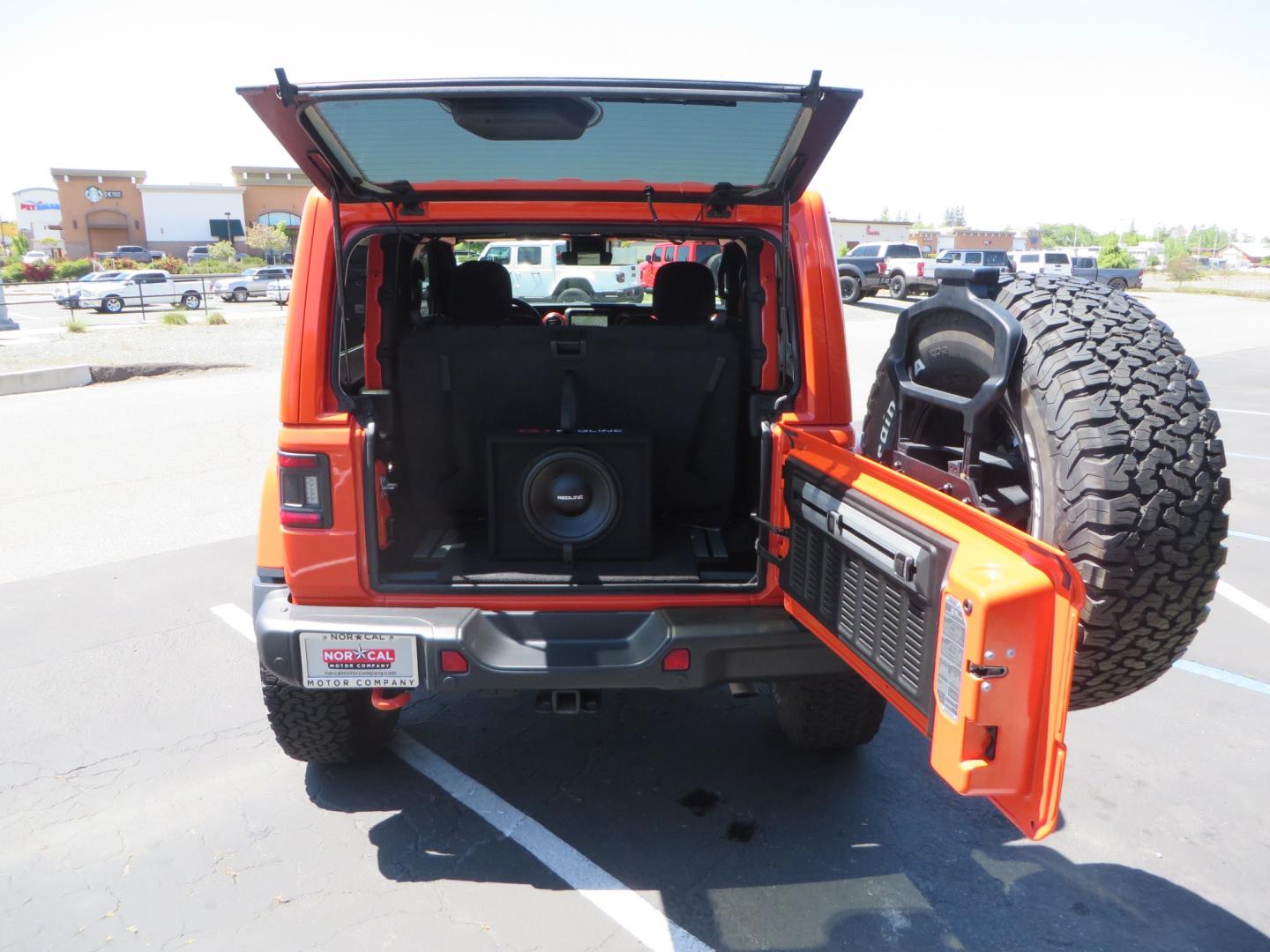 2020 ORANGE /black Jeep Wrangler Rubicon (1C4HJXCG3LW) with an 3.6L V6 DOHC 24V FFV engine, 6A transmission, located at 2630 Grass Valley Highway, Auburn, CA, 95603, (530) 508-5100, 38.937893, -121.095482 - Teraflex suspension, Fox Shocks, Mopar simulated beadlock wheels, 37" BFG KO2 tires, Running boards, Oracle tail lights, window tint, Weathertech floor liners, and a Redline subwoofer. - Photo#42