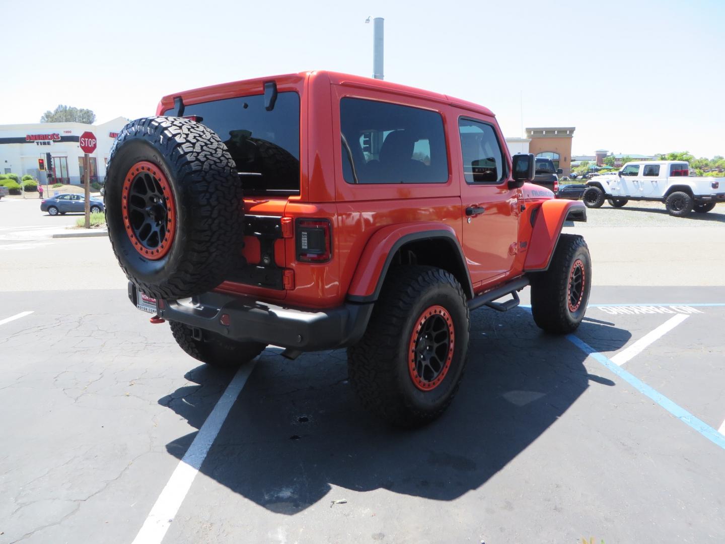 2020 ORANGE /black Jeep Wrangler Rubicon (1C4HJXCG3LW) with an 3.6L V6 DOHC 24V FFV engine, 6A transmission, located at 2630 Grass Valley Highway, Auburn, CA, 95603, (530) 508-5100, 38.937893, -121.095482 - Teraflex suspension, Fox Shocks, Mopar simulated beadlock wheels, 37" BFG KO2 tires, Running boards, Oracle tail lights, window tint, Weathertech floor liners, and a Redline subwoofer. - Photo#4