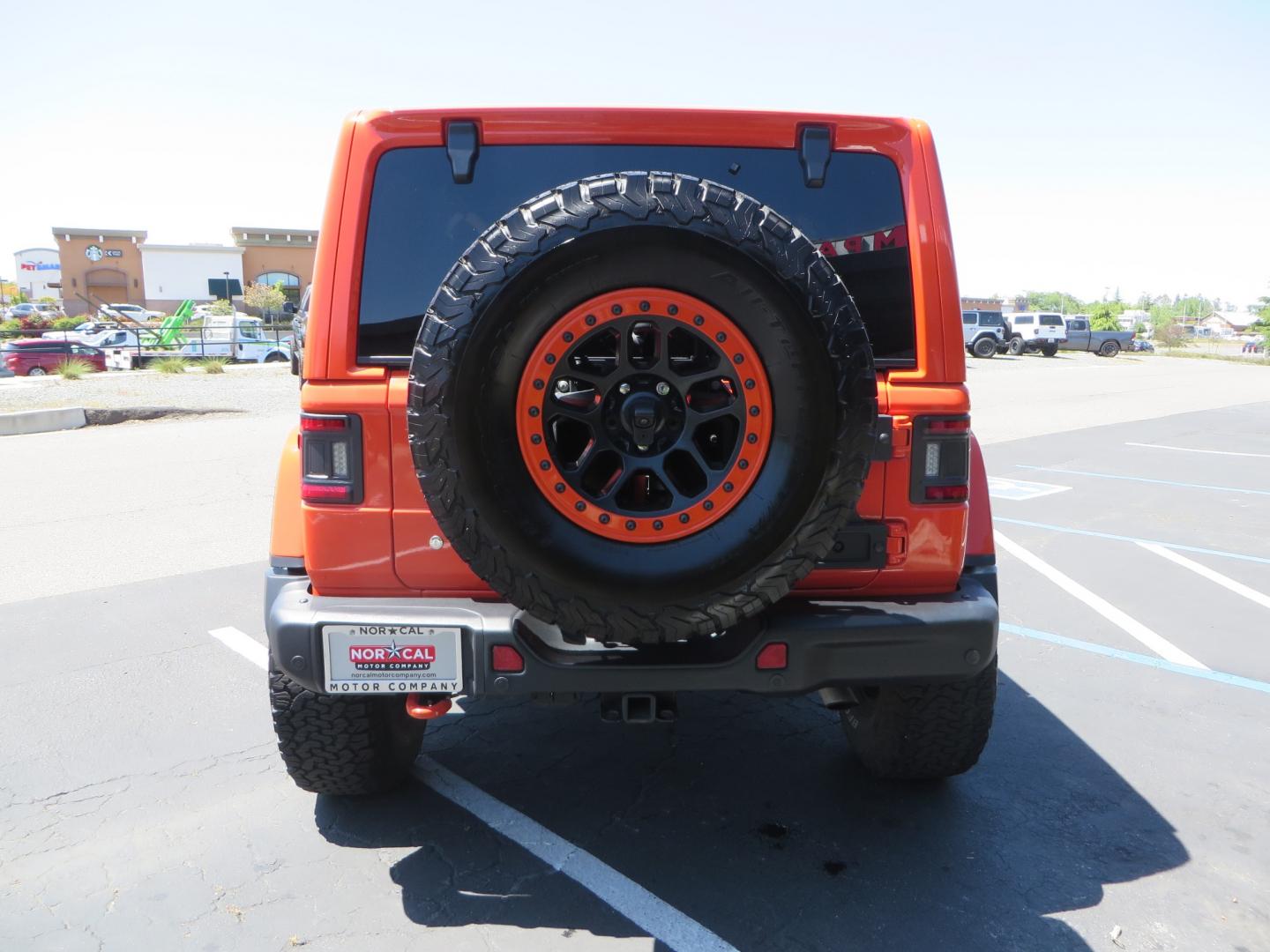 2020 ORANGE /black Jeep Wrangler Rubicon (1C4HJXCG3LW) with an 3.6L V6 DOHC 24V FFV engine, 6A transmission, located at 2630 Grass Valley Highway, Auburn, CA, 95603, (530) 508-5100, 38.937893, -121.095482 - Teraflex suspension, Fox Shocks, Mopar simulated beadlock wheels, 37" BFG KO2 tires, Running boards, Oracle tail lights, window tint, Weathertech floor liners, and a Redline subwoofer. - Photo#5