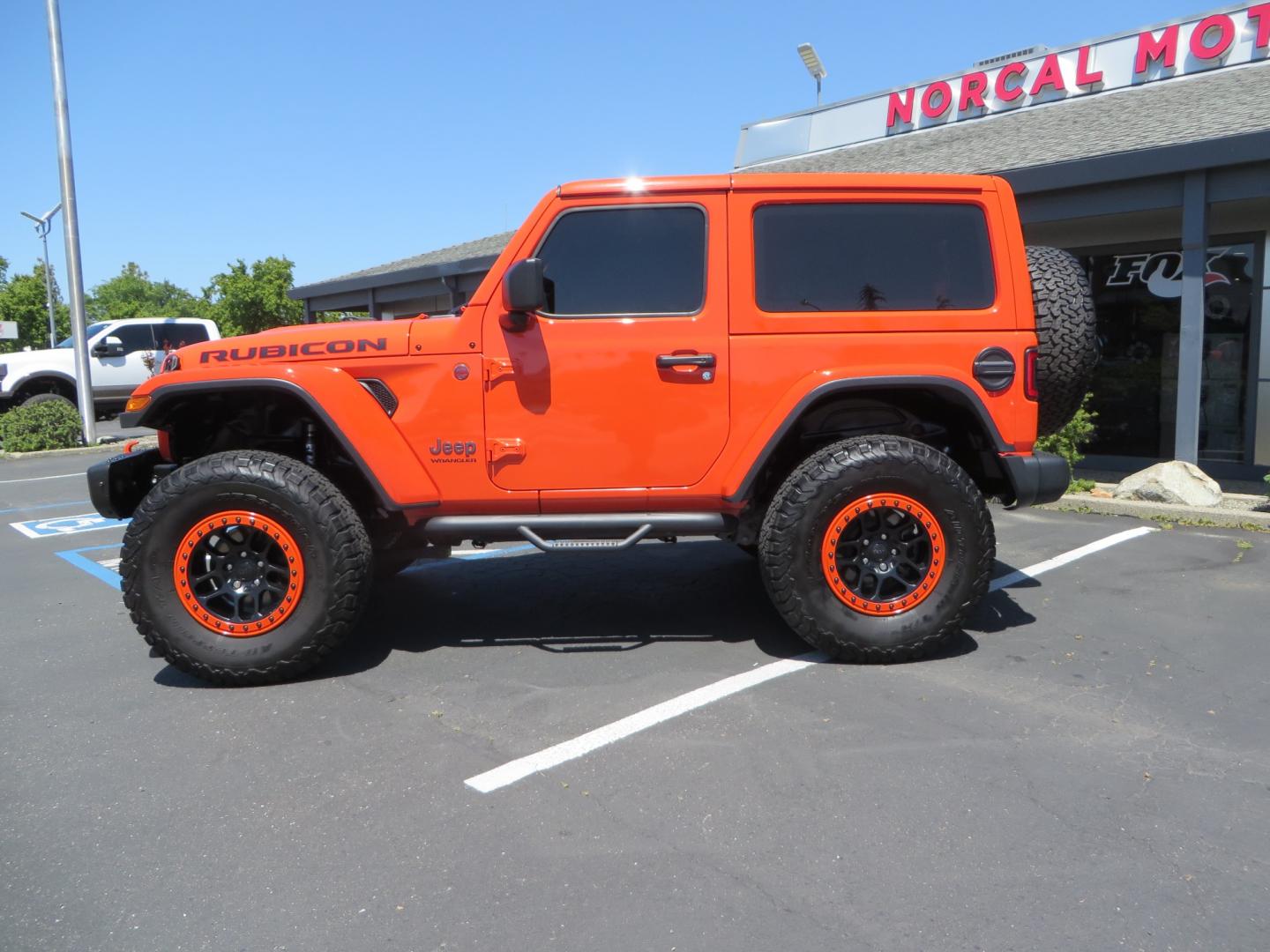 2020 ORANGE /black Jeep Wrangler Rubicon (1C4HJXCG3LW) with an 3.6L V6 DOHC 24V FFV engine, 6A transmission, located at 2630 Grass Valley Highway, Auburn, CA, 95603, (530) 508-5100, 38.937893, -121.095482 - Teraflex suspension, Fox Shocks, Mopar simulated beadlock wheels, 37" BFG KO2 tires, Running boards, Oracle tail lights, window tint, Weathertech floor liners, and a Redline subwoofer. - Photo#7