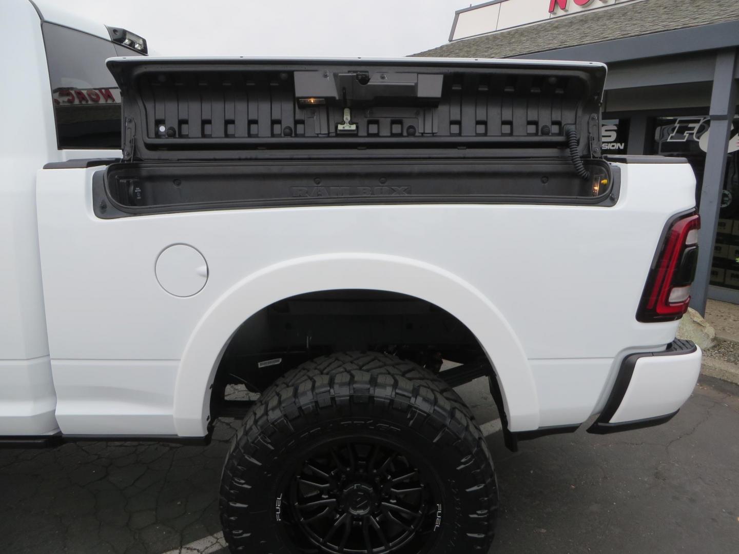 2023 White /BLACK RAM 3500 Limited Mega Cab 4WD (3C63R3PL6PG) with an 6.7L L6 OHV 24V TURBO DIESEL engine, 6A transmission, located at 2630 Grass Valley Highway, Auburn, CA, 95603, (530) 508-5100, 38.937893, -121.095482 - Limited Ram 3500 with a BDS 4" long arm suspension system, Fox 2.5 Performance Elite series shocks, Fox ATS steering stabilizer, Carli Suspension rear leaf spring Add- A-Packs, 37" Nitto Ridge Grappler tires, 20X10 Fuel Clash wheels, CJC Offroad Intercooler guard, B&W tow and stow hitch, Bolt hitch - Photo#17