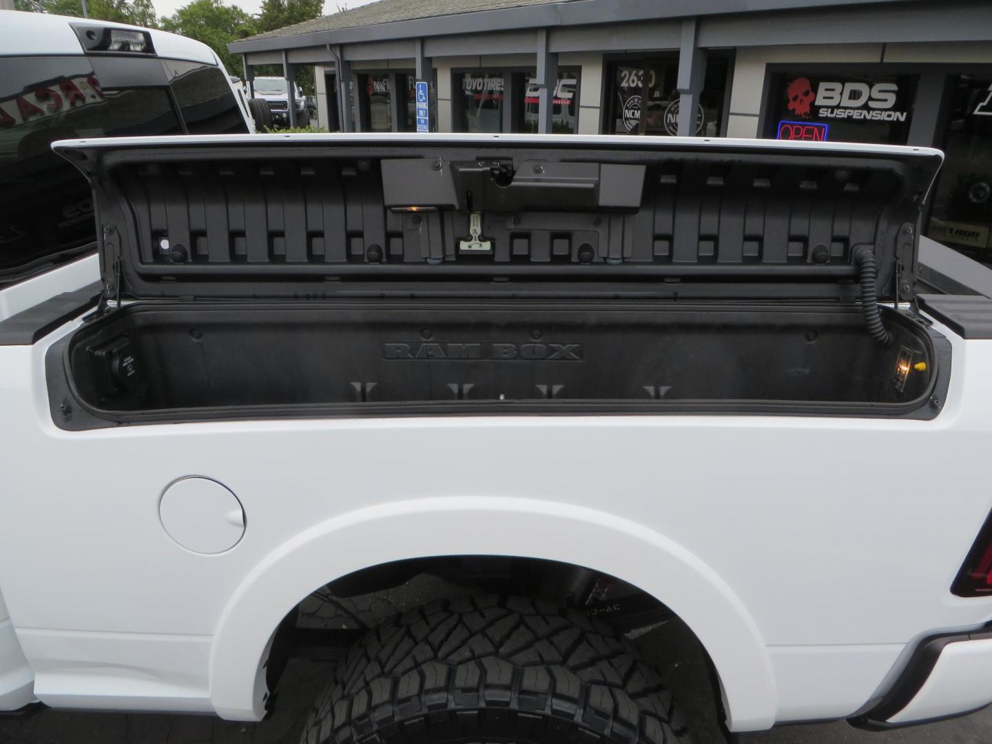 2023 White /BLACK RAM 3500 Limited Mega Cab 4WD (3C63R3PL6PG) with an 6.7L L6 OHV 24V TURBO DIESEL engine, 6A transmission, located at 2630 Grass Valley Highway, Auburn, CA, 95603, (530) 508-5100, 38.937893, -121.095482 - Limited Ram 3500 with a BDS 4" long arm suspension system, Fox 2.5 Performance Elite series shocks, Fox ATS steering stabilizer, Carli Suspension rear leaf spring Add- A-Packs, 37" Nitto Ridge Grappler tires, 20X10 Fuel Clash wheels, CJC Offroad Intercooler guard, B&W tow and stow hitch, Bolt hitch - Photo#18