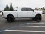 2023 White /BLACK RAM 3500 Limited Mega Cab 4WD (3C63R3PL6PG) with an 6.7L L6 OHV 24V TURBO DIESEL engine, 6A transmission, located at 2630 Grass Valley Highway, Auburn, CA, 95603, (530) 508-5100, 38.937893, -121.095482 - Limited Ram 3500 with a BDS 4" long arm suspension system, Fox 2.5 Performance Elite series shocks, Fox ATS steering stabilizer, Carli Suspension rear leaf spring Add- A-Packs, 37" Nitto Ridge Grappler tires, 20X10 Fuel Clash wheels, CJC Offroad Intercooler guard, B&W tow and stow hitch, Bolt hitch - Photo#3