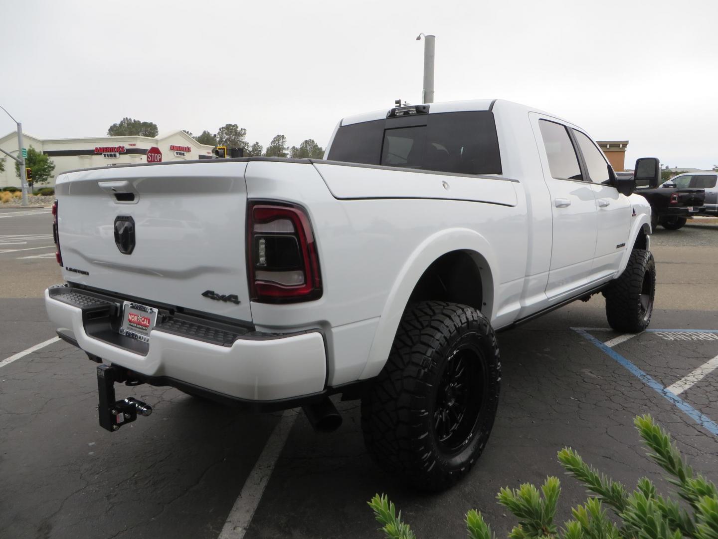 2023 White /BLACK RAM 3500 Limited Mega Cab 4WD (3C63R3PL6PG) with an 6.7L L6 OHV 24V TURBO DIESEL engine, 6A transmission, located at 2630 Grass Valley Highway, Auburn, CA, 95603, (530) 508-5100, 38.937893, -121.095482 - Limited Ram 3500 with a BDS 4" long arm suspension system, Fox 2.5 Performance Elite series shocks, Fox ATS steering stabilizer, Carli Suspension rear leaf spring Add- A-Packs, 37" Nitto Ridge Grappler tires, 20X10 Fuel Clash wheels, CJC Offroad Intercooler guard, B&W tow and stow hitch, Bolt hitch - Photo#4