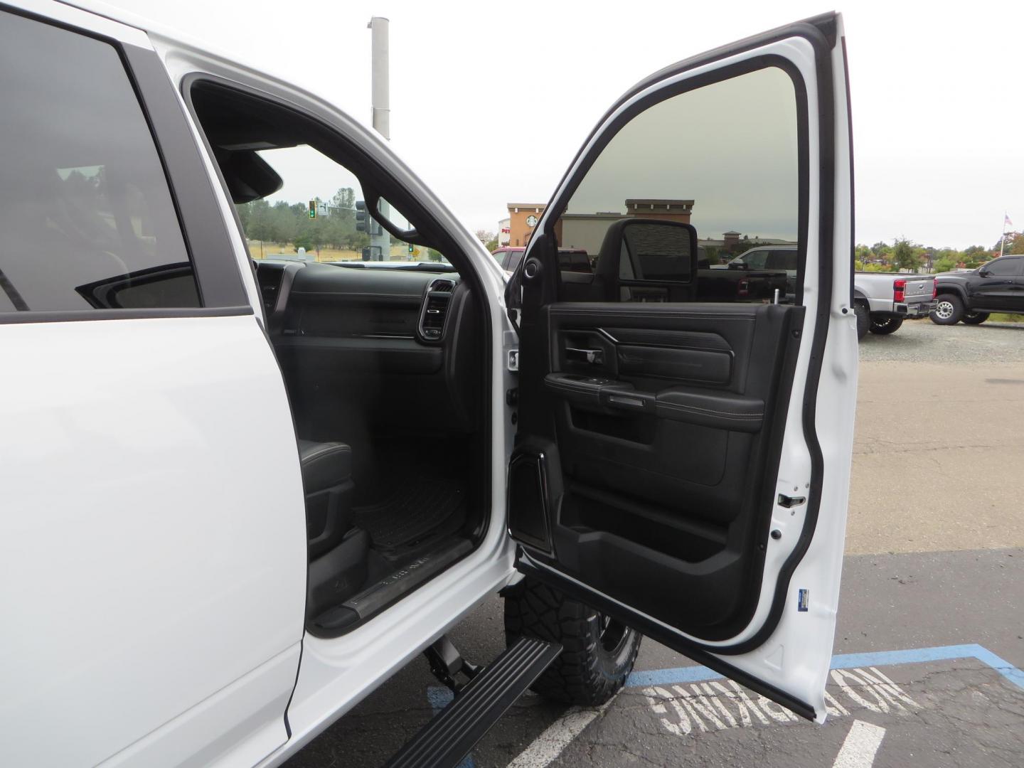 2023 White /BLACK RAM 3500 Limited Mega Cab 4WD (3C63R3PL6PG) with an 6.7L L6 OHV 24V TURBO DIESEL engine, 6A transmission, located at 2630 Grass Valley Highway, Auburn, CA, 95603, (530) 508-5100, 38.937893, -121.095482 - Limited Ram 3500 with a BDS 4" long arm suspension system, Fox 2.5 Performance Elite series shocks, Fox ATS steering stabilizer, Carli Suspension rear leaf spring Add- A-Packs, 37" Nitto Ridge Grappler tires, 20X10 Fuel Clash wheels, CJC Offroad Intercooler guard, B&W tow and stow hitch, Bolt hitch - Photo#71