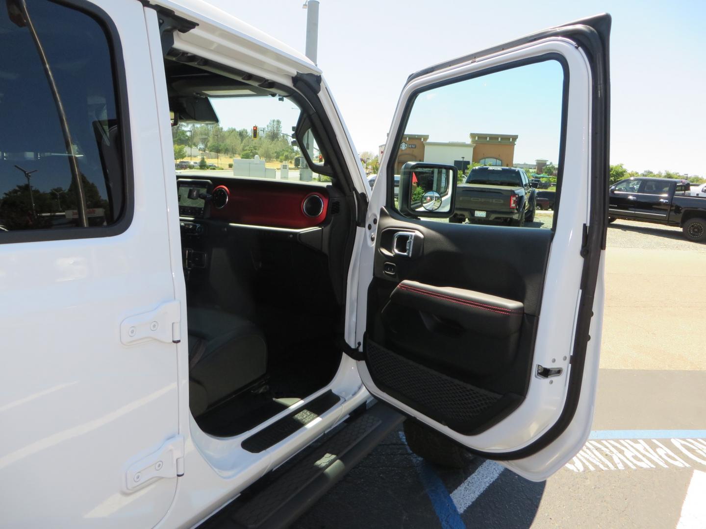 2021 White /BLACK Jeep Wrangler Unlimited Rubicon (1C4HJXFG1MW) with an 3.6L V6 DOHC 24V FFV engine, Manual 6 speed transmission, located at 2630 Grass Valley Highway, Auburn, CA, 95603, (530) 508-5100, 38.937893, -121.095482 - This manual transmission Rubicon is set up with a Mopar suspension systems, Fox shocks, 17" Method Race wheels, and 35" Falken Wildpeak AT3W tires. - Photo#44