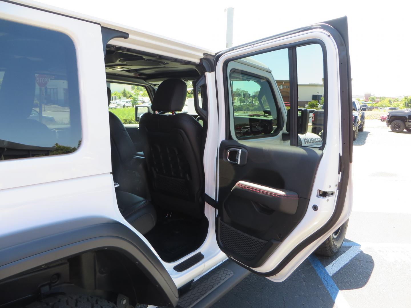 2021 White /BLACK Jeep Wrangler Unlimited Rubicon (1C4HJXFG1MW) with an 3.6L V6 DOHC 24V FFV engine, Manual 6 speed transmission, located at 2630 Grass Valley Highway, Auburn, CA, 95603, (530) 508-5100, 38.937893, -121.095482 - This manual transmission Rubicon is set up with a Mopar suspension systems, Fox shocks, 17" Method Race wheels, and 35" Falken Wildpeak AT3W tires. - Photo#51