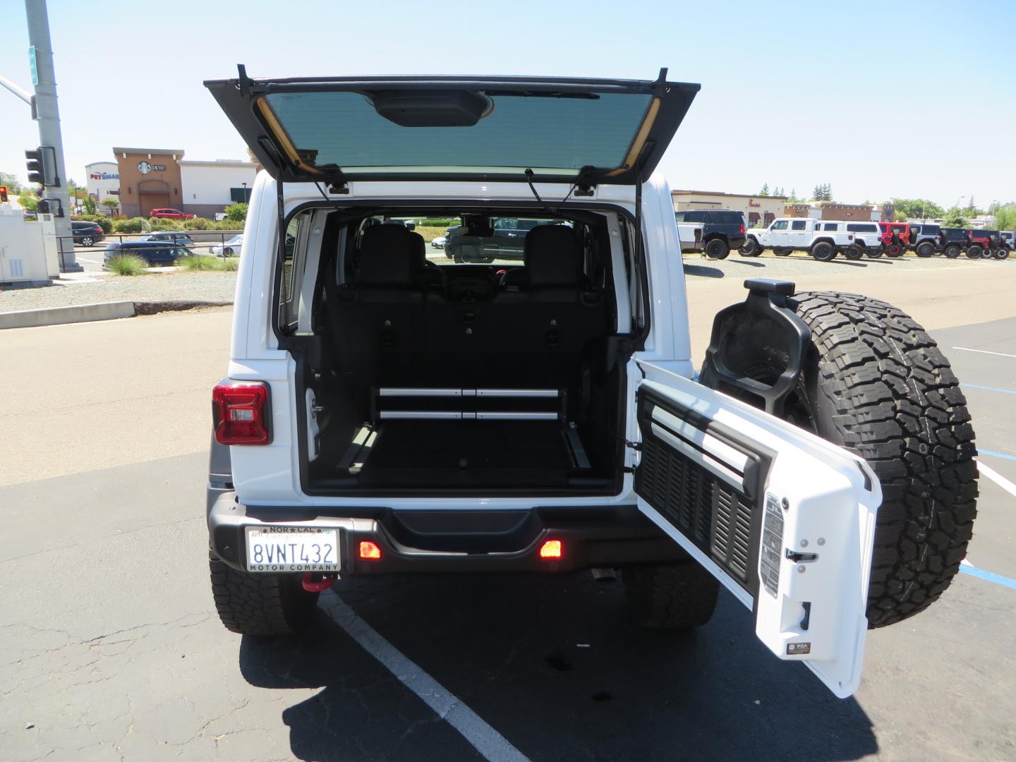 2021 White /BLACK Jeep Wrangler Unlimited Rubicon (1C4HJXFG1MW) with an 3.6L V6 DOHC 24V FFV engine, Manual 6 speed transmission, located at 2630 Grass Valley Highway, Auburn, CA, 95603, (530) 508-5100, 38.937893, -121.095482 - This manual transmission Rubicon is set up with a Mopar suspension systems, Fox shocks, 17" Method Race wheels, and 35" Falken Wildpeak AT3W tires. - Photo#58