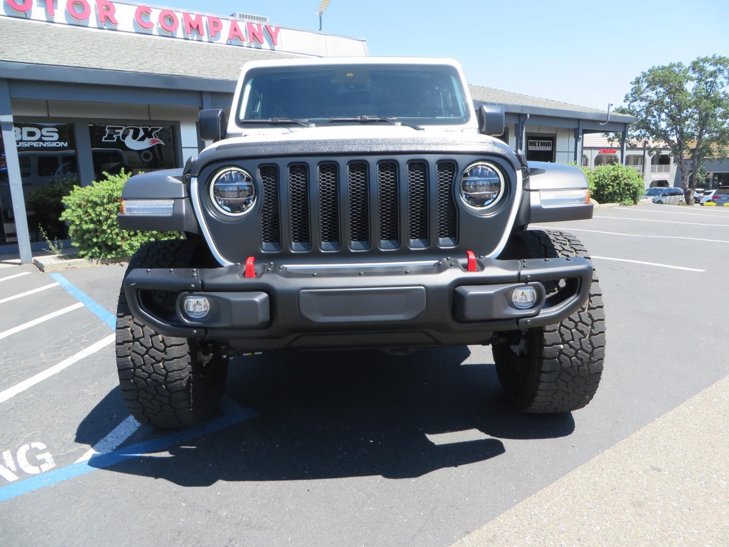 2021 White /BLACK Jeep Wrangler Unlimited Rubicon (1C4HJXFG1MW) with an 3.6L V6 DOHC 24V FFV engine, Manual 6 speed transmission, located at 2630 Grass Valley Highway, Auburn, CA, 95603, (530) 508-5100, 38.937893, -121.095482 - This manual transmission Rubicon is set up with a Mopar suspension systems, Fox shocks, 17" Method Race wheels, and 35" Falken Wildpeak AT3W tires. - Photo#1