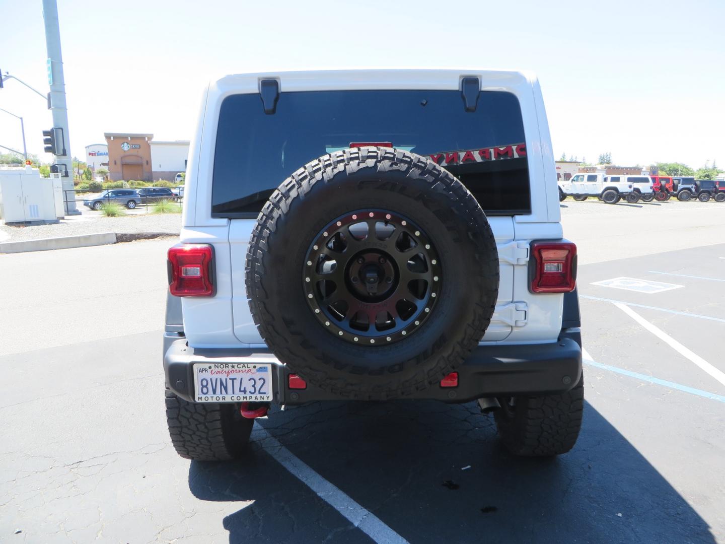 2021 White /BLACK Jeep Wrangler Unlimited Rubicon (1C4HJXFG1MW) with an 3.6L V6 DOHC 24V FFV engine, Manual 6 speed transmission, located at 2630 Grass Valley Highway, Auburn, CA, 95603, (530) 508-5100, 38.937893, -121.095482 - This manual transmission Rubicon is set up with a Mopar suspension systems, Fox shocks, 17" Method Race wheels, and 35" Falken Wildpeak AT3W tires. - Photo#5