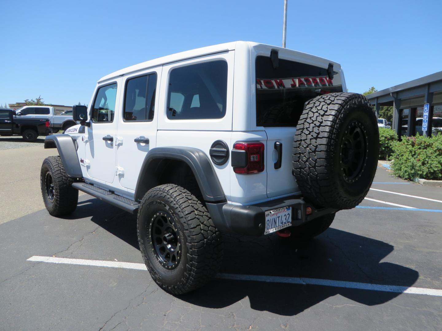 2021 White /BLACK Jeep Wrangler Unlimited Rubicon (1C4HJXFG1MW) with an 3.6L V6 DOHC 24V FFV engine, Manual 6 speed transmission, located at 2630 Grass Valley Highway, Auburn, CA, 95603, (530) 508-5100, 38.937893, -121.095482 - This manual transmission Rubicon is set up with a Mopar suspension systems, Fox shocks, 17" Method Race wheels, and 35" Falken Wildpeak AT3W tires. - Photo#6