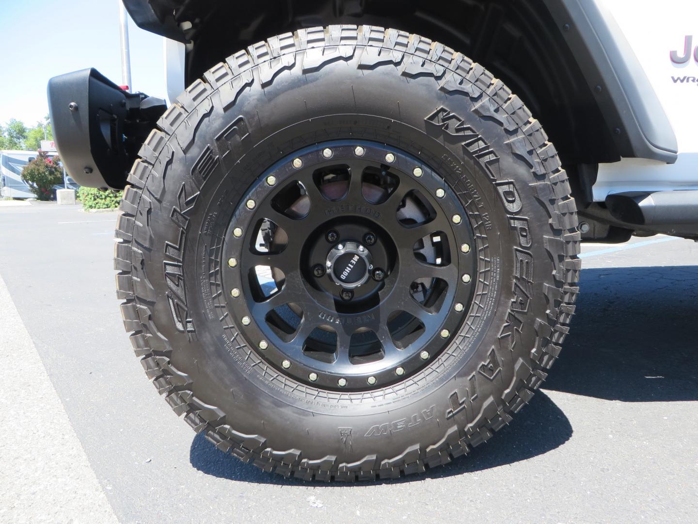 2021 White /BLACK Jeep Wrangler Unlimited Rubicon (1C4HJXFG1MW) with an 3.6L V6 DOHC 24V FFV engine, Manual 6 speed transmission, located at 2630 Grass Valley Highway, Auburn, CA, 95603, (530) 508-5100, 38.937893, -121.095482 - This manual transmission Rubicon is set up with a Mopar suspension systems, Fox shocks, 17" Method Race wheels, and 35" Falken Wildpeak AT3W tires. - Photo#8