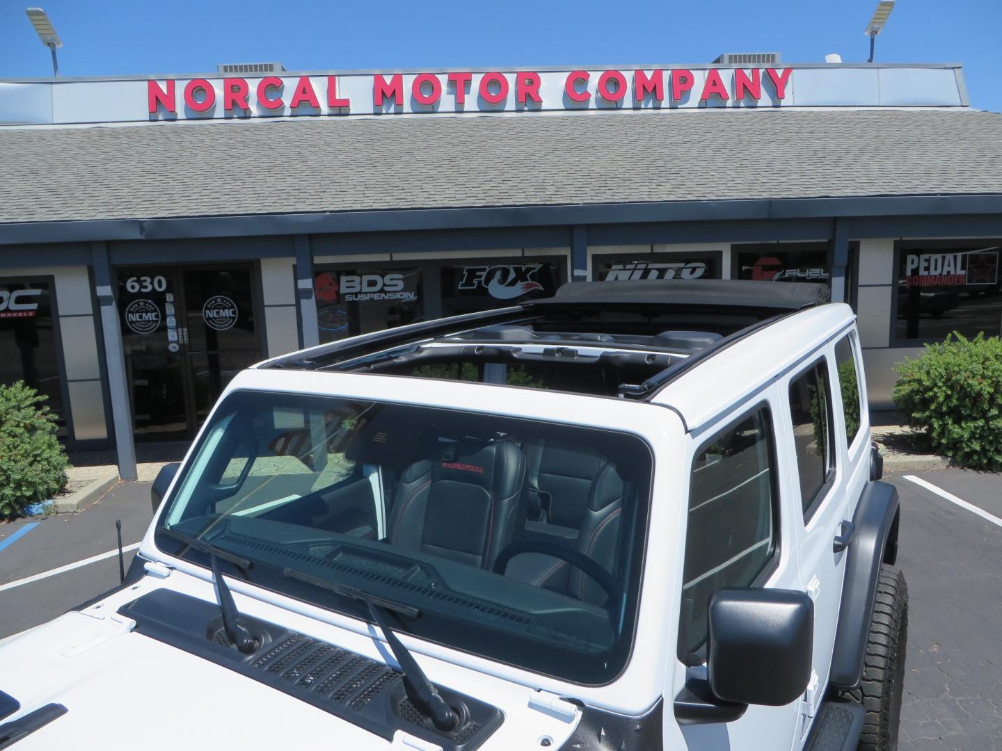 2021 White /BLACK Jeep Wrangler Unlimited Rubicon (1C4HJXFG1MW) with an 3.6L V6 DOHC 24V FFV engine, Manual 6 speed transmission, located at 2630 Grass Valley Highway, Auburn, CA, 95603, (530) 508-5100, 38.937893, -121.095482 - This manual transmission Rubicon is set up with a Mopar suspension systems, Fox shocks, 17" Method Race wheels, and 35" Falken Wildpeak AT3W tires. - Photo#12