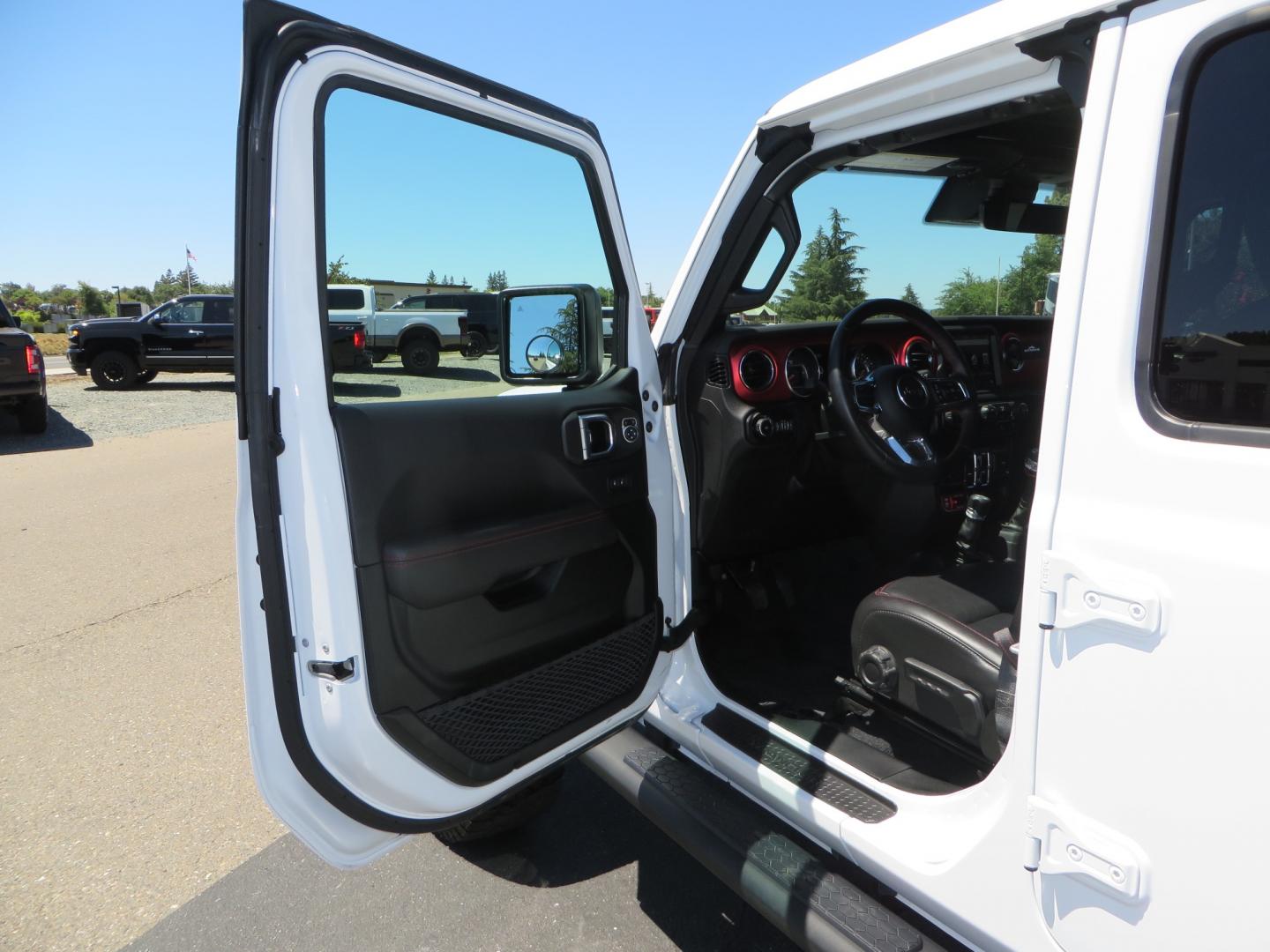 2021 White /BLACK Jeep Wrangler Unlimited Rubicon (1C4HJXFG1MW) with an 3.6L V6 DOHC 24V FFV engine, Manual 6 speed transmission, located at 2630 Grass Valley Highway, Auburn, CA, 95603, (530) 508-5100, 38.937893, -121.095482 - This manual transmission Rubicon is set up with a Mopar suspension systems, Fox shocks, 17" Method Race wheels, and 35" Falken Wildpeak AT3W tires. - Photo#14