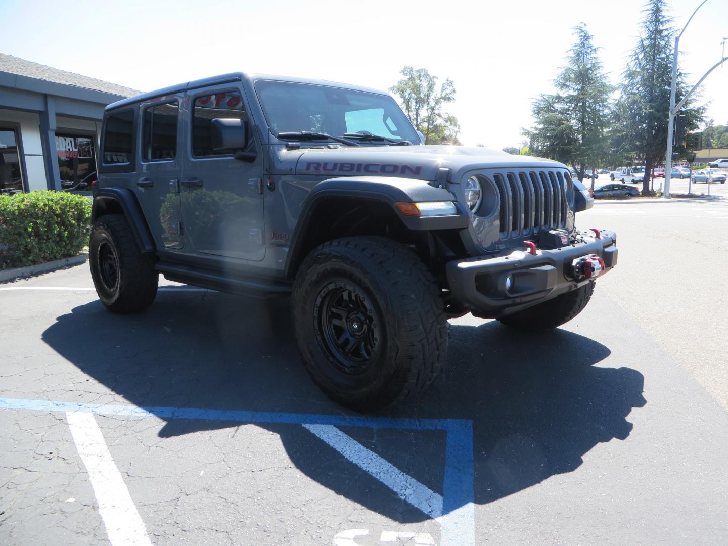 2019 Gray /RED Jeep Wrangler Unlimited Rubicon (1C4HJXFN0KW) with an 2.0L L4 DOHC 16V TURBO engine, 6A transmission, located at 2630 Grass Valley Highway, Auburn, CA, 95603, (530) 508-5100, 38.937893, -121.095482 - Lifted wrangler featuring 17" Fuel wheels, 35" Toyo Open Country RT tires, Warn VR10 synthetic rope winch, Factor 55 Ultra Hook, Westin running boards, window tint, Weathertech floor liners, and custom red / black interior. - Photo#2