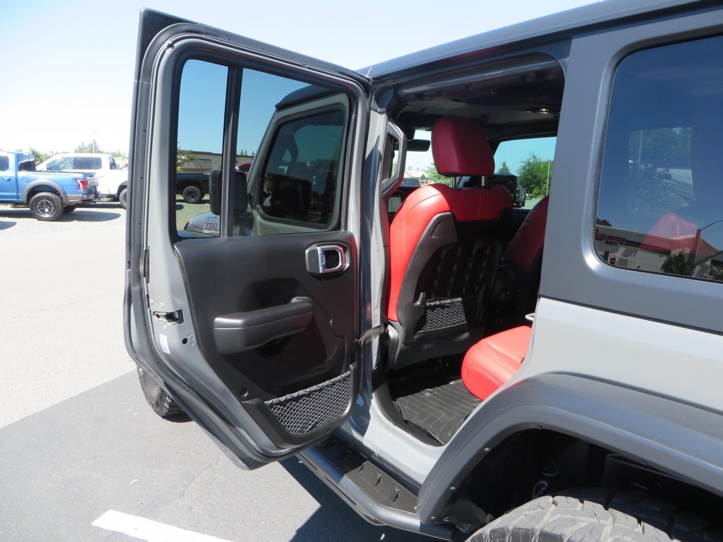 2019 Gray /RED Jeep Wrangler Unlimited Rubicon (1C4HJXFN0KW) with an 2.0L L4 DOHC 16V TURBO engine, 6A transmission, located at 2630 Grass Valley Highway, Auburn, CA, 95603, (530) 508-5100, 38.937893, -121.095482 - Lifted wrangler featuring 17" Fuel wheels, 35" Toyo Open Country RT tires, Warn VR10 synthetic rope winch, Factor 55 Ultra Hook, Westin running boards, window tint, Weathertech floor liners, and custom red / black interior. - Photo#35