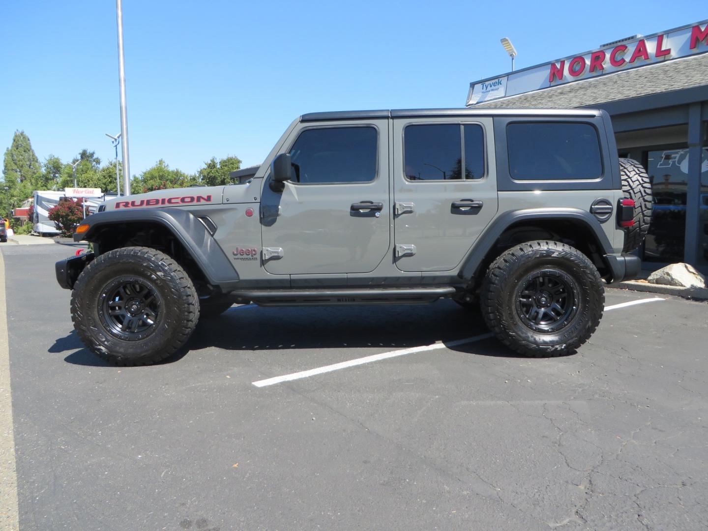 2019 Gray /RED Jeep Wrangler Unlimited Rubicon (1C4HJXFN0KW) with an 2.0L L4 DOHC 16V TURBO engine, 6A transmission, located at 2630 Grass Valley Highway, Auburn, CA, 95603, (530) 508-5100, 38.937893, -121.095482 - Lifted wrangler featuring 17" Fuel wheels, 35" Toyo Open Country RT tires, Warn VR10 synthetic rope winch, Factor 55 Ultra Hook, Westin running boards, window tint, Weathertech floor liners, and custom red / black interior. - Photo#7