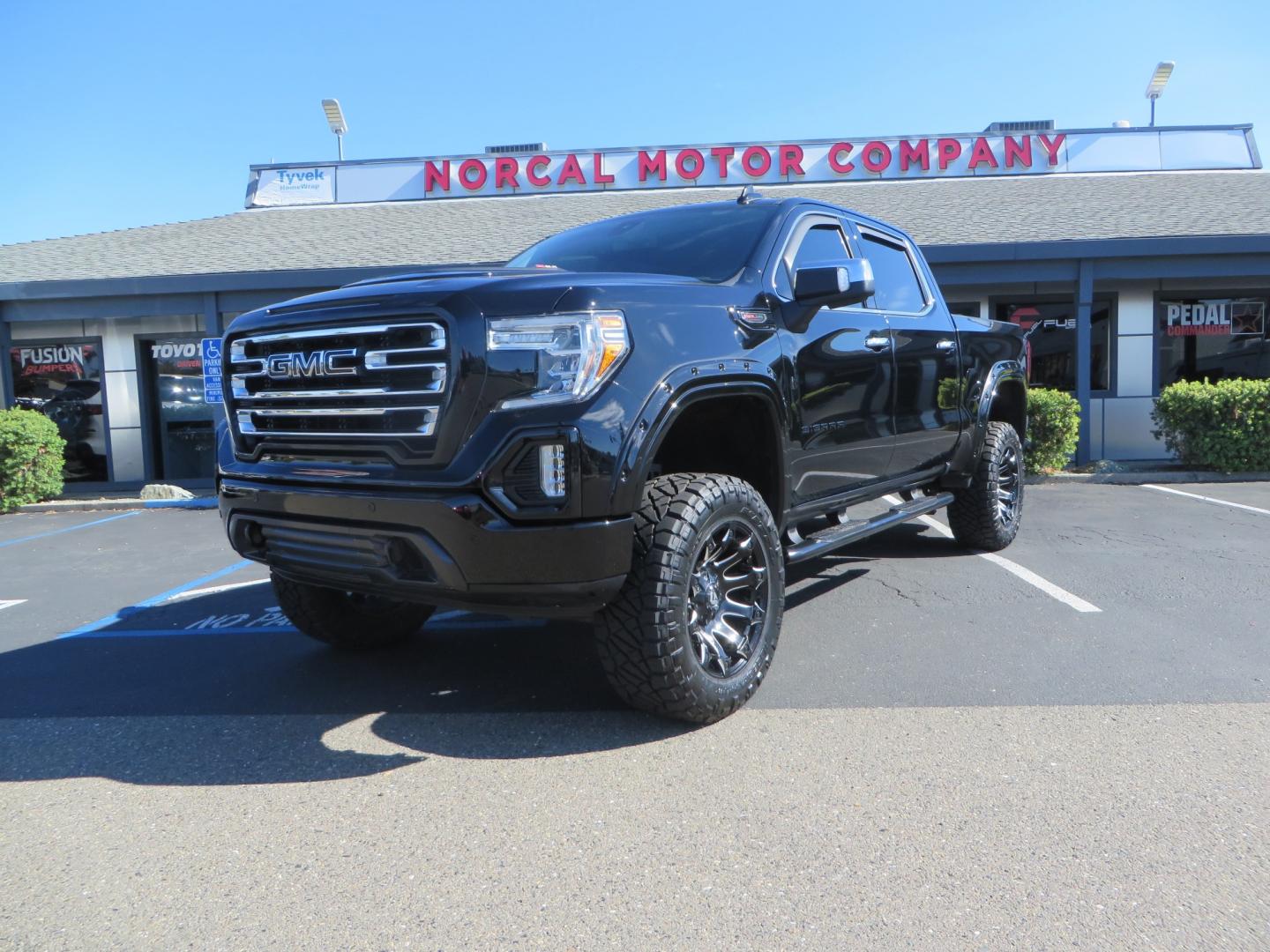 2020 Black GMC Sierra 1500 SLT Crew Cab Short Box 4WD (3GTU9DEL2LG) with an 6.2L V8 OHV 16V engine, 6A transmission, located at 2630 Grass Valley Highway, Auburn, CA, 95603, (530) 508-5100, 38.937893, -121.095482 - An American Luxury Coach Z92 built 1500. Features a 6" Lift kit, 20" Fuel wheels, 35" Nitto Ridge Grappler tires, Westin Running boards, Power Tonneau cover, Window tint, Katzkin leather, and window deflectors. - Photo#0