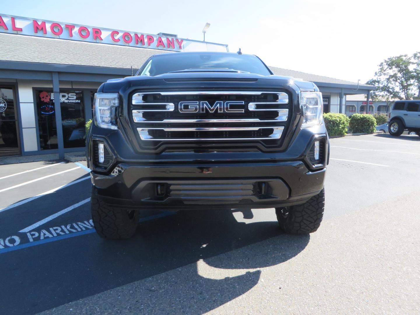 2020 Black GMC Sierra 1500 SLT Crew Cab Short Box 4WD (3GTU9DEL2LG) with an 6.2L V8 OHV 16V engine, 6A transmission, located at 2630 Grass Valley Highway, Auburn, CA, 95603, (530) 508-5100, 38.937893, -121.095482 - An American Luxury Coach Z92 built 1500. Features a 6" Lift kit, 20" Fuel wheels, 35" Nitto Ridge Grappler tires, Westin Running boards, Power Tonneau cover, Window tint, Katzkin leather, and window deflectors. - Photo#1