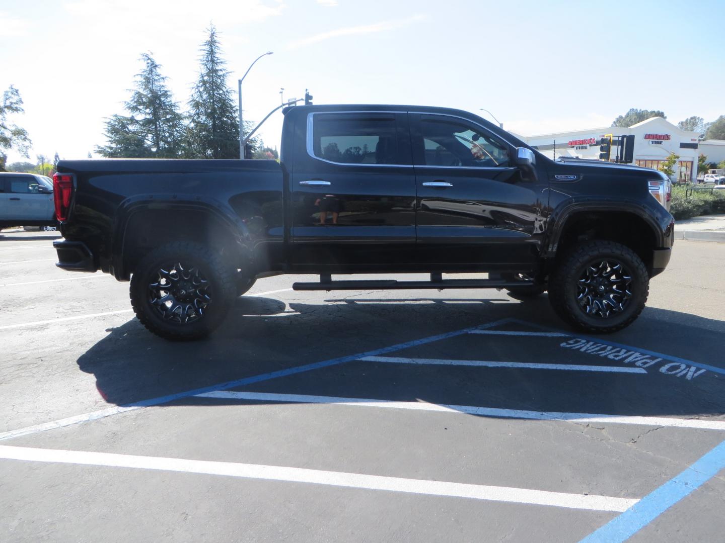 2020 Black GMC Sierra 1500 SLT Crew Cab Short Box 4WD (3GTU9DEL2LG) with an 6.2L V8 OHV 16V engine, 6A transmission, located at 2630 Grass Valley Highway, Auburn, CA, 95603, (530) 508-5100, 38.937893, -121.095482 - An American Luxury Coach Z92 built 1500. Features a 6" Lift kit, 20" Fuel wheels, 35" Nitto Ridge Grappler tires, Westin Running boards, Power Tonneau cover, Window tint, Katzkin leather, and window deflectors. - Photo#3