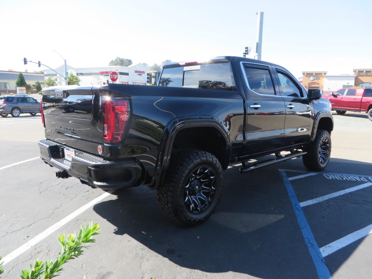 2020 Black GMC Sierra 1500 SLT Crew Cab Short Box 4WD (3GTU9DEL2LG) with an 6.2L V8 OHV 16V engine, 6A transmission, located at 2630 Grass Valley Highway, Auburn, CA, 95603, (530) 508-5100, 38.937893, -121.095482 - An American Luxury Coach Z92 built 1500. Features a 6" Lift kit, 20" Fuel wheels, 35" Nitto Ridge Grappler tires, Westin Running boards, Power Tonneau cover, Window tint, Katzkin leather, and window deflectors. - Photo#4