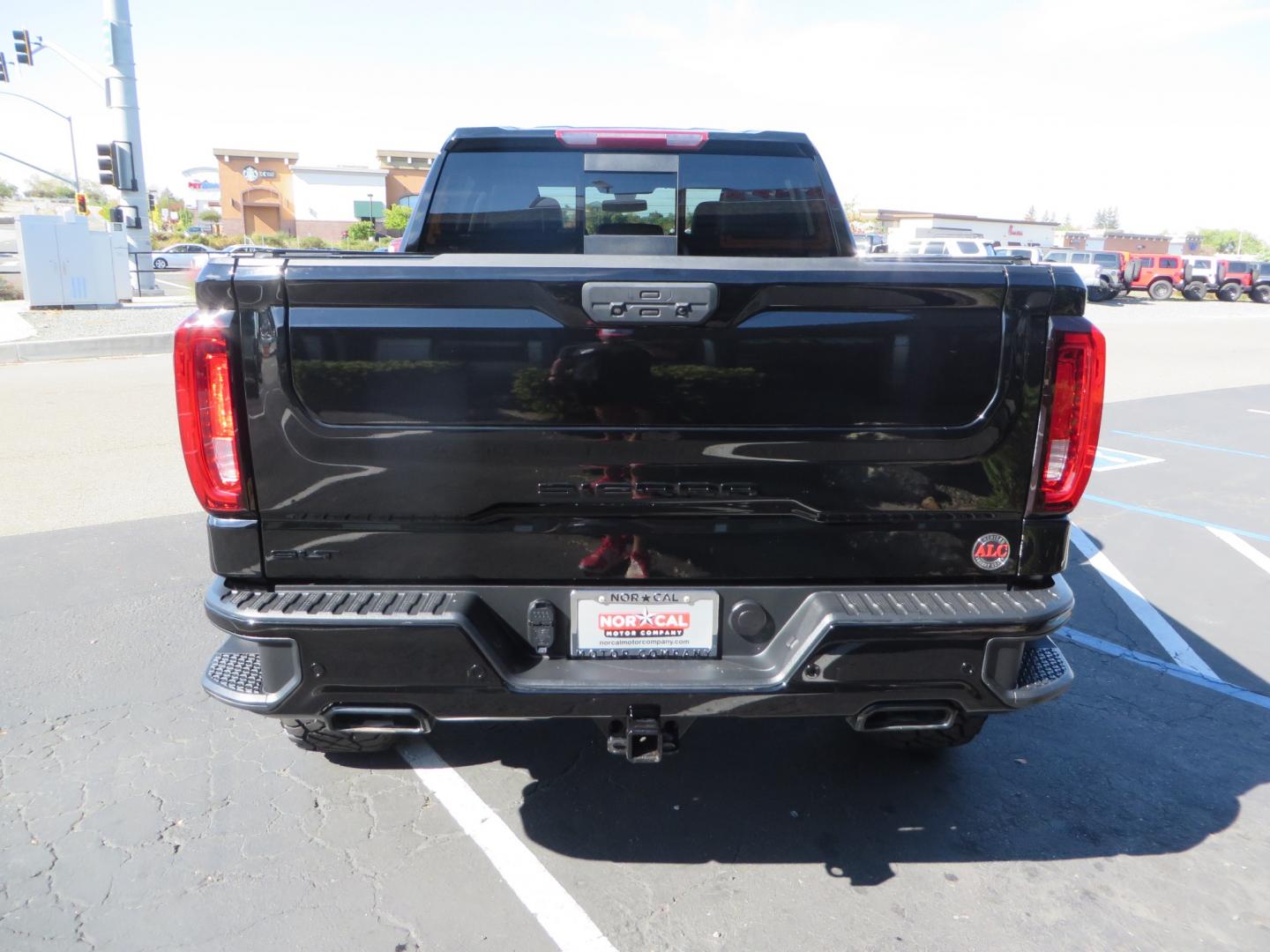 2020 Black GMC Sierra 1500 SLT Crew Cab Short Box 4WD (3GTU9DEL2LG) with an 6.2L V8 OHV 16V engine, 6A transmission, located at 2630 Grass Valley Highway, Auburn, CA, 95603, (530) 508-5100, 38.937893, -121.095482 - An American Luxury Coach Z92 built 1500. Features a 6" Lift kit, 20" Fuel wheels, 35" Nitto Ridge Grappler tires, Westin Running boards, Power Tonneau cover, Window tint, Katzkin leather, and window deflectors. - Photo#5