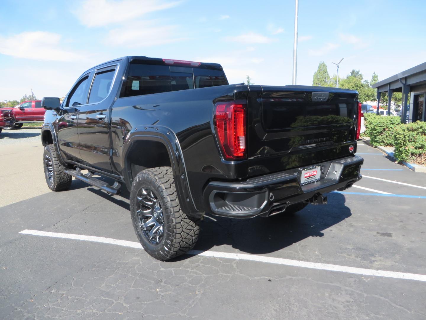 2020 Black GMC Sierra 1500 SLT Crew Cab Short Box 4WD (3GTU9DEL2LG) with an 6.2L V8 OHV 16V engine, 6A transmission, located at 2630 Grass Valley Highway, Auburn, CA, 95603, (530) 508-5100, 38.937893, -121.095482 - An American Luxury Coach Z92 built 1500. Features a 6" Lift kit, 20" Fuel wheels, 35" Nitto Ridge Grappler tires, Westin Running boards, Power Tonneau cover, Window tint, Katzkin leather, and window deflectors. - Photo#6