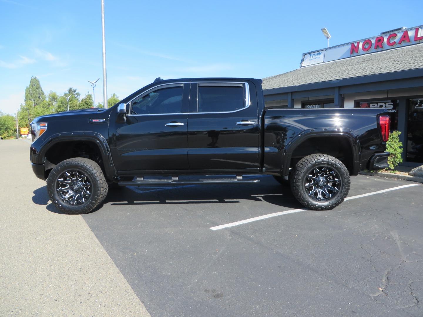 2020 Black GMC Sierra 1500 SLT Crew Cab Short Box 4WD (3GTU9DEL2LG) with an 6.2L V8 OHV 16V engine, 6A transmission, located at 2630 Grass Valley Highway, Auburn, CA, 95603, (530) 508-5100, 38.937893, -121.095482 - An American Luxury Coach Z92 built 1500. Features a 6" Lift kit, 20" Fuel wheels, 35" Nitto Ridge Grappler tires, Westin Running boards, Power Tonneau cover, Window tint, Katzkin leather, and window deflectors. - Photo#7