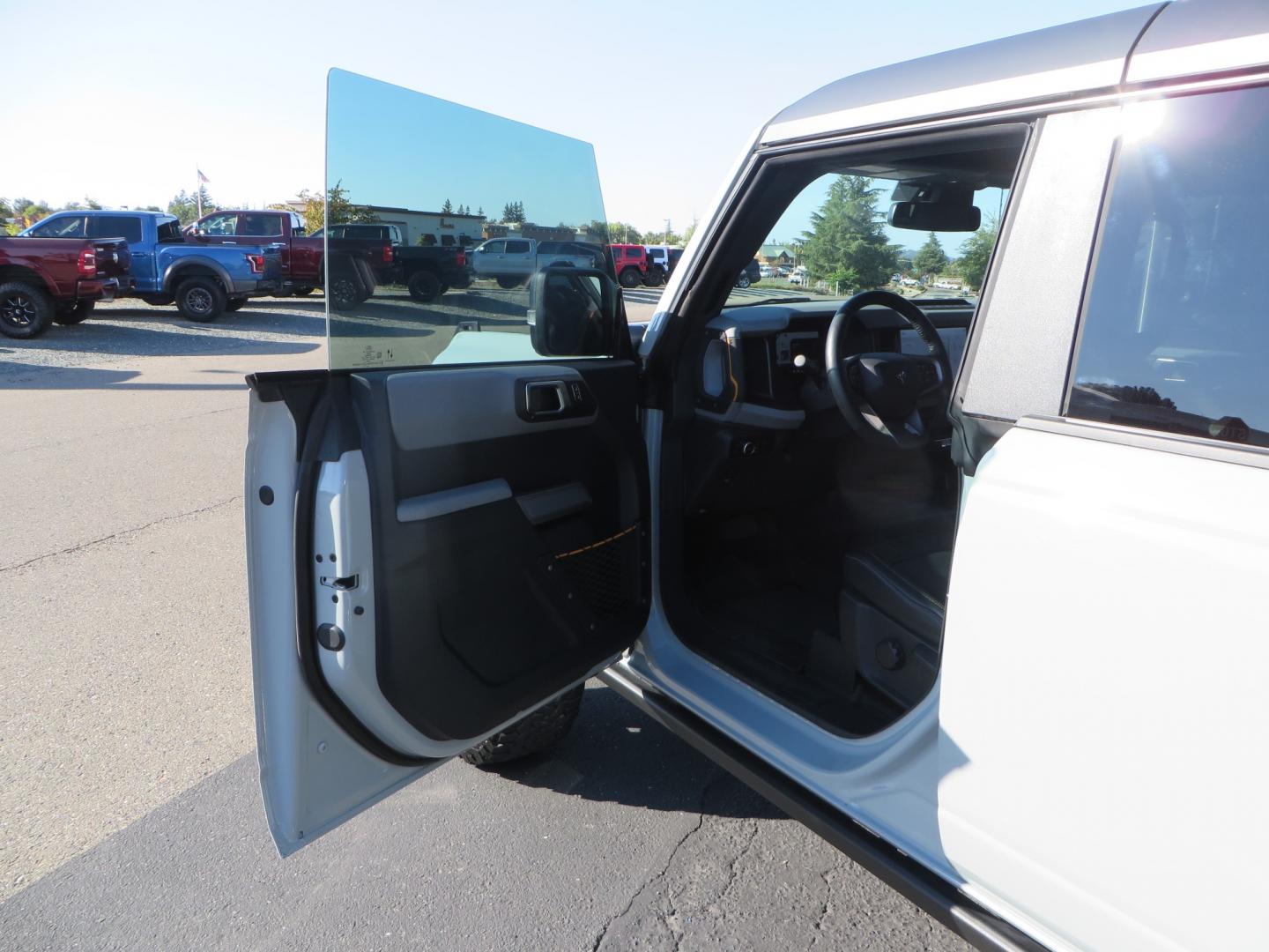 2023 Gray /BLACK Ford Bronco Badlands 4-Door w/Advanced (1FMEE5DP1PL) with an 2.7L V6 DOHC 24V engine, 7M transmission, located at 2630 Grass Valley Highway, Auburn, CA, 95603, (530) 508-5100, 38.937893, -121.095482 - Features a Zone offroad 1" level kit, 17" American Racing Baja wheels, 35" BFG KO2 tires, window tint, RC spare tire relocation & 3rd brake light extension. - Photo#12