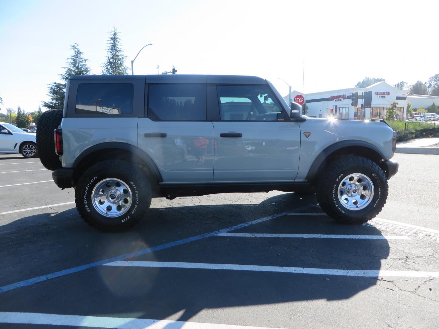 2023 Gray /BLACK Ford Bronco Badlands 4-Door w/Advanced (1FMEE5DP1PL) with an 2.7L V6 DOHC 24V engine, 7M transmission, located at 2630 Grass Valley Highway, Auburn, CA, 95603, (530) 508-5100, 38.937893, -121.095482 - Features a Zone offroad 1" level kit, 17" American Racing Baja wheels, 35" BFG KO2 tires, window tint, RC spare tire relocation & 3rd brake light extension. - Photo#3