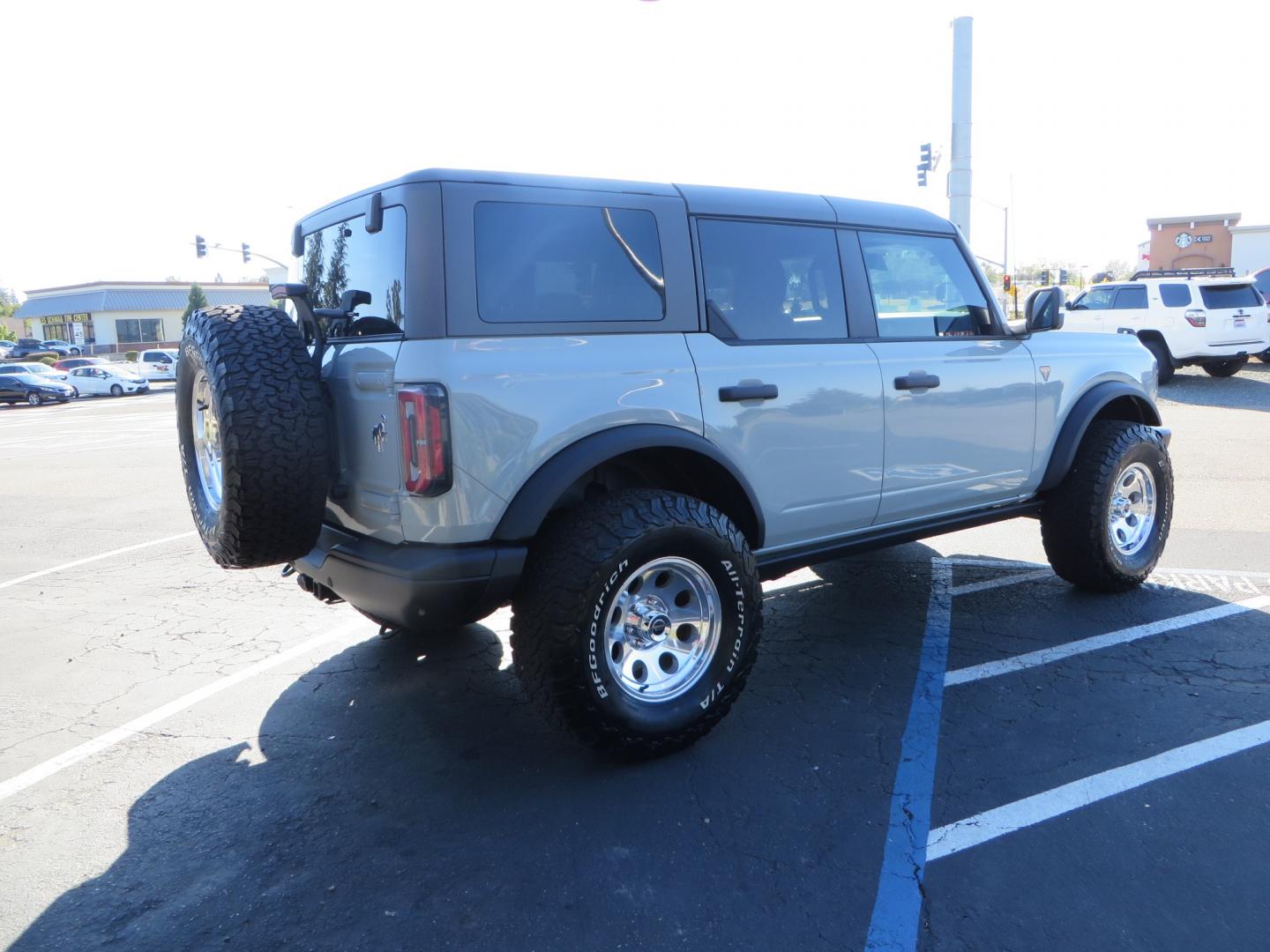 2023 Gray /BLACK Ford Bronco Badlands 4-Door w/Advanced (1FMEE5DP1PL) with an 2.7L V6 DOHC 24V engine, 7M transmission, located at 2630 Grass Valley Highway, Auburn, CA, 95603, (530) 508-5100, 38.937893, -121.095482 - Features a Zone offroad 1" level kit, 17" American Racing Baja wheels, 35" BFG KO2 tires, window tint, RC spare tire relocation & 3rd brake light extension. - Photo#4