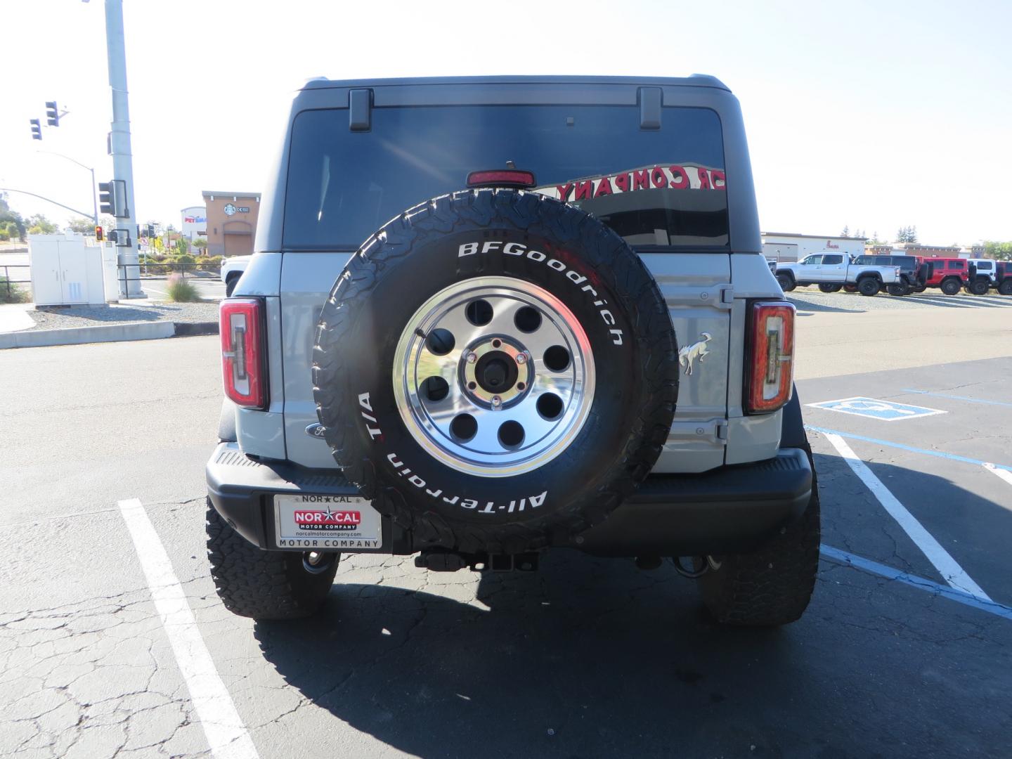 2023 Gray /BLACK Ford Bronco Badlands 4-Door w/Advanced (1FMEE5DP1PL) with an 2.7L V6 DOHC 24V engine, 7M transmission, located at 2630 Grass Valley Highway, Auburn, CA, 95603, (530) 508-5100, 38.937893, -121.095482 - Features a Zone offroad 1" level kit, 17" American Racing Baja wheels, 35" BFG KO2 tires, window tint, RC spare tire relocation & 3rd brake light extension. - Photo#5