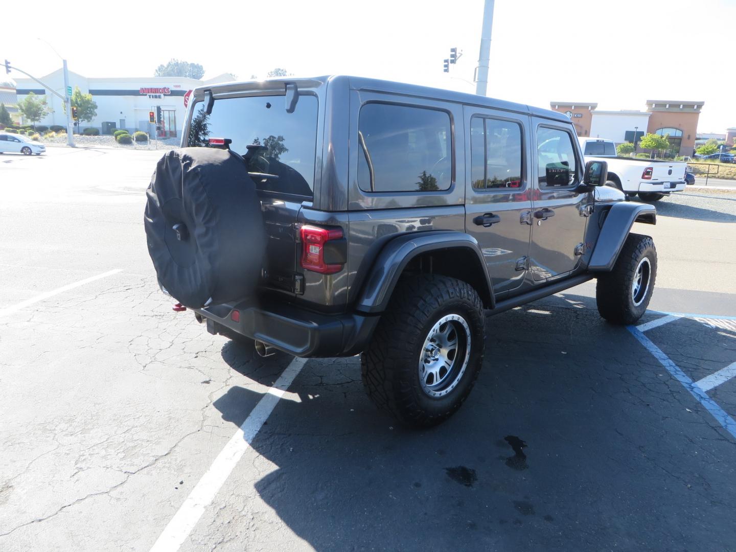 2018 CHARCOAL /TAN Jeep Wrangler JL Unlimited Rubicon (1C4HJXFG4JW) with an 3.6L V6 DOHC 24V FFV engine, 6A transmission, located at 2630 Grass Valley Highway, Auburn, CA, 95603, (530) 508-5100, 38.937893, -121.095482 - Must see Jeep with Fox shocks, Raceline wheels, Nitto Ridge Grappler tires, Dual Exhaust, and window tint. - Photo#4