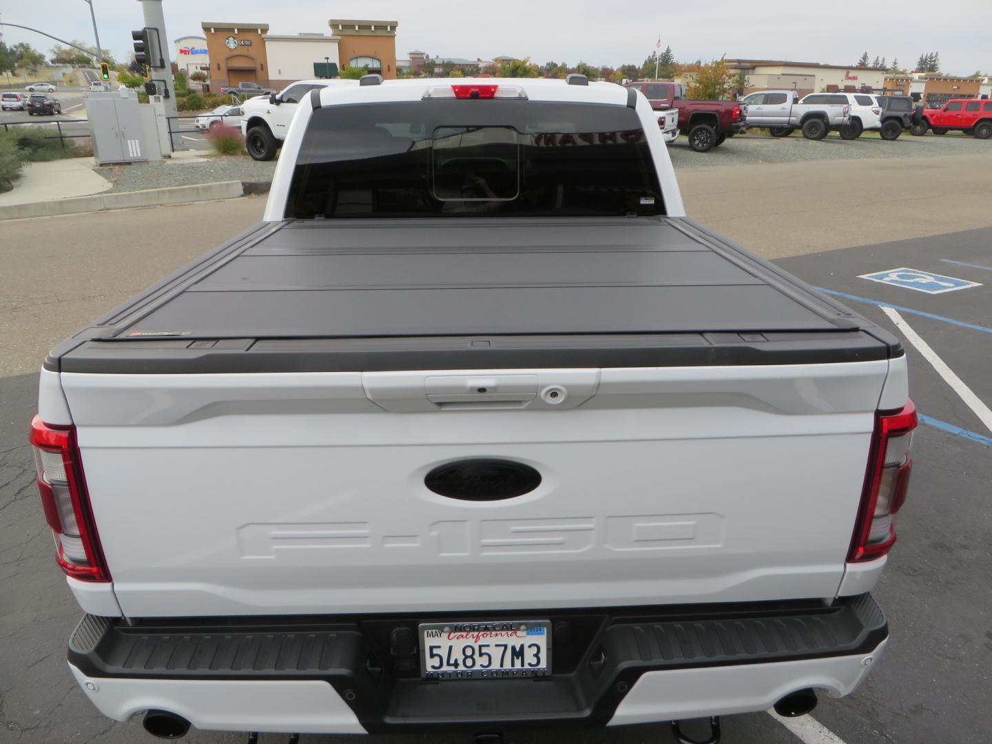 2022 White /black Ford F-150 Tremor SuperCrew 5.5-ft. Bed 4WD (1FTEW1E82NF) with an 3.5L V6 TURBO engine, 10 speed transmission, located at 2630 Grass Valley Highway, Auburn, CA, 95603, (530) 508-5100, 38.937893, -121.095482 - Tremor F150 Featuring an Icon Vehicle Dynamics stage 4 suspension system, 17" Method NV doubl eblack wheels, Nitto Ridge Grappler tires, Bakflip MX4, window tint, and custom paint to eliminate the Tremor orange and blue Ford emblems. - Photo#13