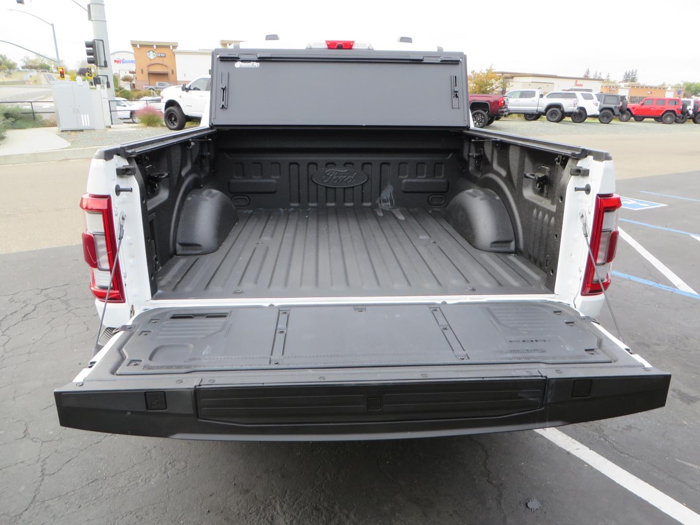 2022 White /black Ford F-150 Tremor SuperCrew 5.5-ft. Bed 4WD (1FTEW1E82NF) with an 3.5L V6 TURBO engine, 10 speed transmission, located at 2630 Grass Valley Highway, Auburn, CA, 95603, (530) 508-5100, 38.937893, -121.095482 - Tremor F150 Featuring an Icon Vehicle Dynamics stage 4 suspension system, 17" Method NV doubl eblack wheels, Nitto Ridge Grappler tires, Bakflip MX4, window tint, and custom paint to eliminate the Tremor orange and blue Ford emblems. - Photo#14