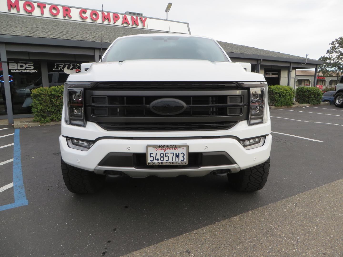 2022 White /black Ford F-150 Tremor SuperCrew 5.5-ft. Bed 4WD (1FTEW1E82NF) with an 3.5L V6 TURBO engine, 10 speed transmission, located at 2630 Grass Valley Highway, Auburn, CA, 95603, (530) 508-5100, 38.937893, -121.095482 - Tremor F150 Featuring an Icon Vehicle Dynamics stage 4 suspension system, 17" Method NV doubl eblack wheels, Nitto Ridge Grappler tires, Bakflip MX4, window tint, and custom paint to eliminate the Tremor orange and blue Ford emblems. - Photo#1