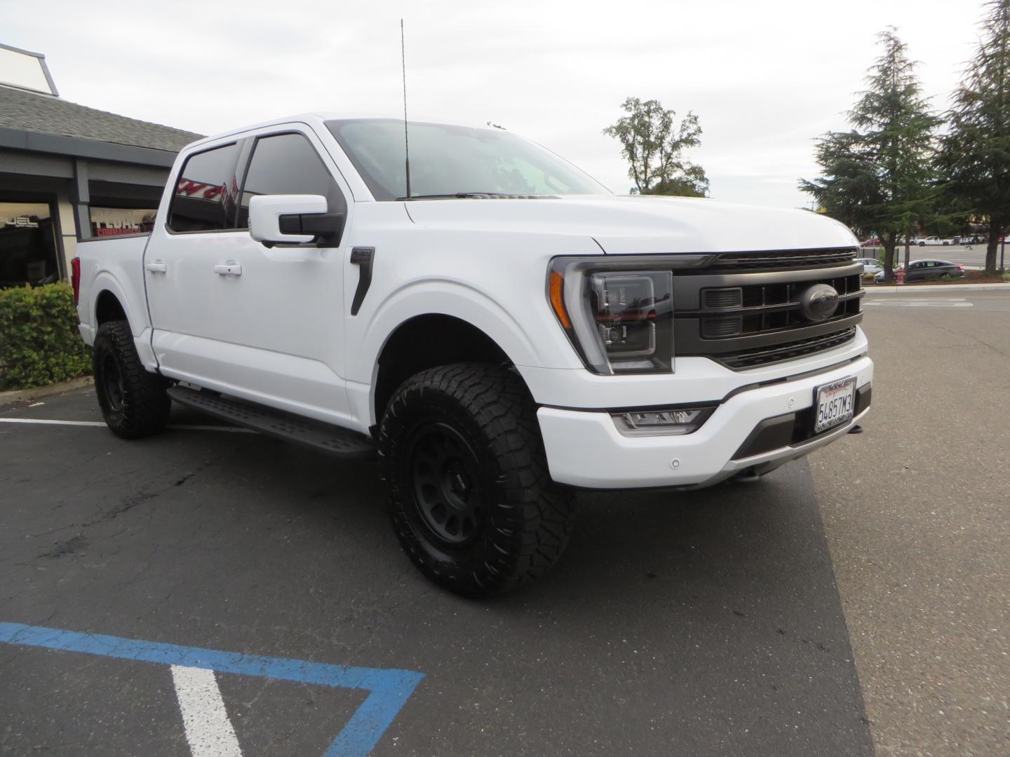 2022 White /black Ford F-150 Tremor SuperCrew 5.5-ft. Bed 4WD (1FTEW1E82NF) with an 3.5L V6 TURBO engine, 10 speed transmission, located at 2630 Grass Valley Highway, Auburn, CA, 95603, (530) 508-5100, 38.937893, -121.095482 - Tremor F150 Featuring an Icon Vehicle Dynamics stage 4 suspension system, 17" Method NV doubl eblack wheels, Nitto Ridge Grappler tires, Bakflip MX4, window tint, and custom paint to eliminate the Tremor orange and blue Ford emblems. - Photo#2