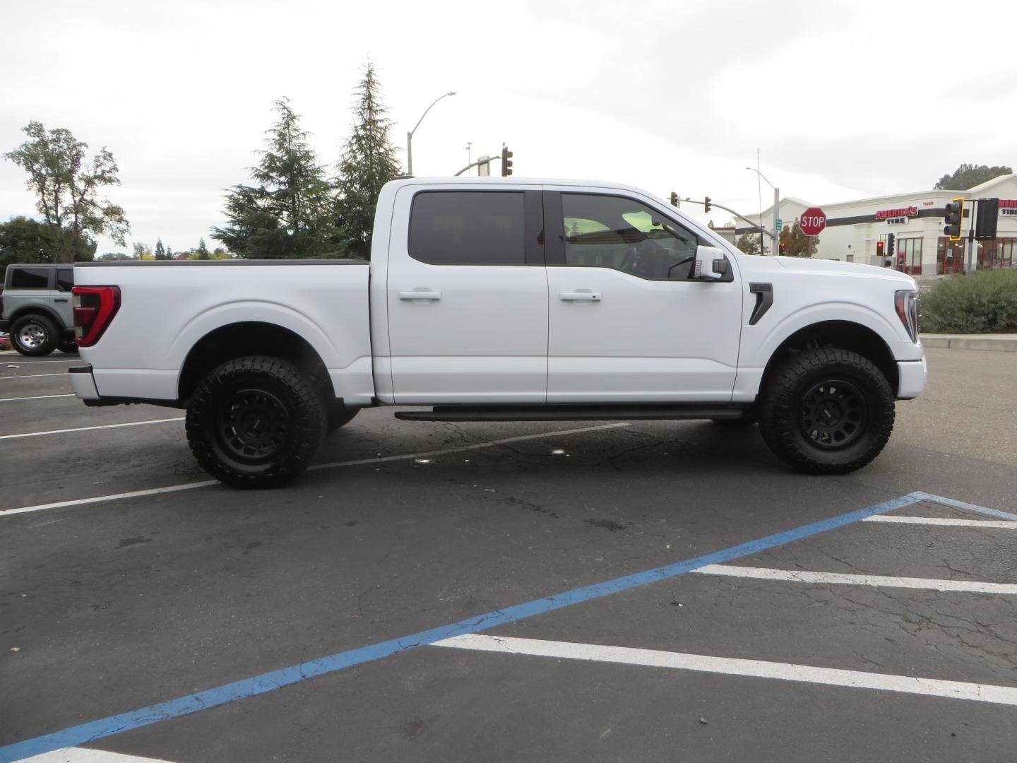 2022 White /black Ford F-150 Tremor SuperCrew 5.5-ft. Bed 4WD (1FTEW1E82NF) with an 3.5L V6 TURBO engine, 10 speed transmission, located at 2630 Grass Valley Highway, Auburn, CA, 95603, (530) 508-5100, 38.937893, -121.095482 - Tremor F150 Featuring an Icon Vehicle Dynamics stage 4 suspension system, 17" Method NV doubl eblack wheels, Nitto Ridge Grappler tires, Bakflip MX4, window tint, and custom paint to eliminate the Tremor orange and blue Ford emblems. - Photo#3